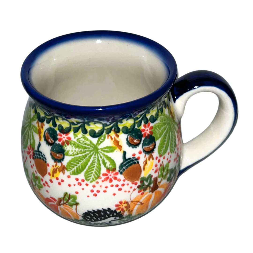 Kalich Polish Pottery Hedgehog Pumpkins Acorns pattern 1103 features hand-painted hedgehogs, pumpkins, and acorns in a vibrant autumn design on durable stoneware.