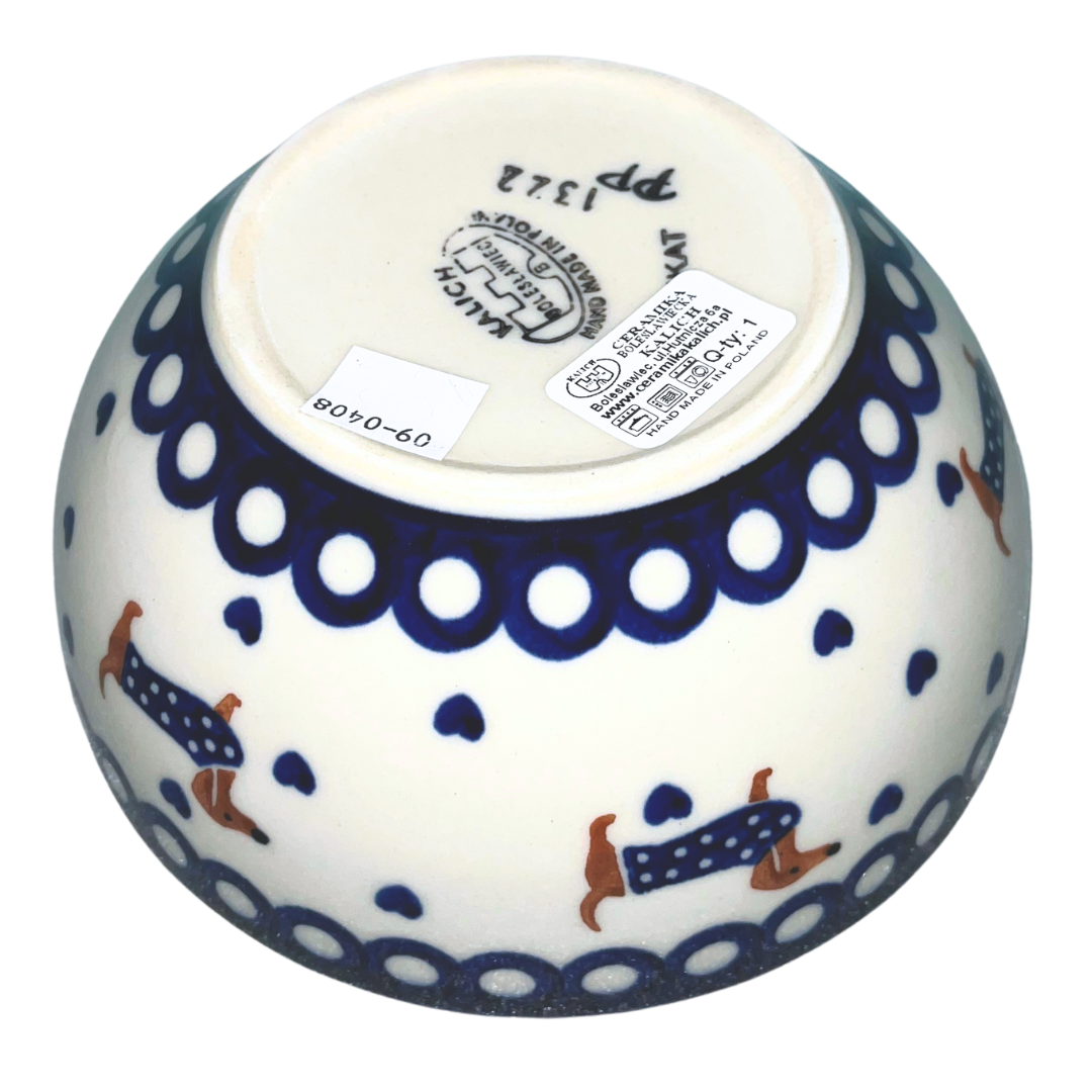 Ceramika Kalich Pattern 1322 Dachshunds features playful dachshunds in blue coats with scattered blue hearts and cobalt accents. Hand-painted Polish pottery from Poland.