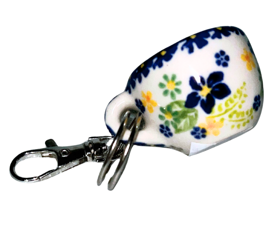 Hand-painted Polish Pottery key chain from Bolesławiec, Poland. Mini cup charm with floral design and metal clasp—perfect for keys, bags, or gifts.