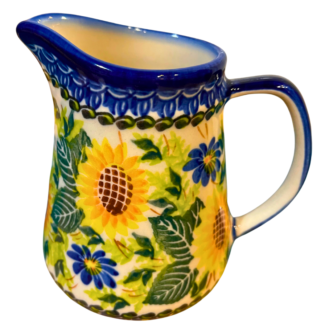 Ceramika Kalich Pattern 580 Sunflowers Polish pottery featuring bright sunflower and blue floral design. Authentic handcrafted Bolesławiec stoneware, durable, dishwasher, microwave, and oven safe.