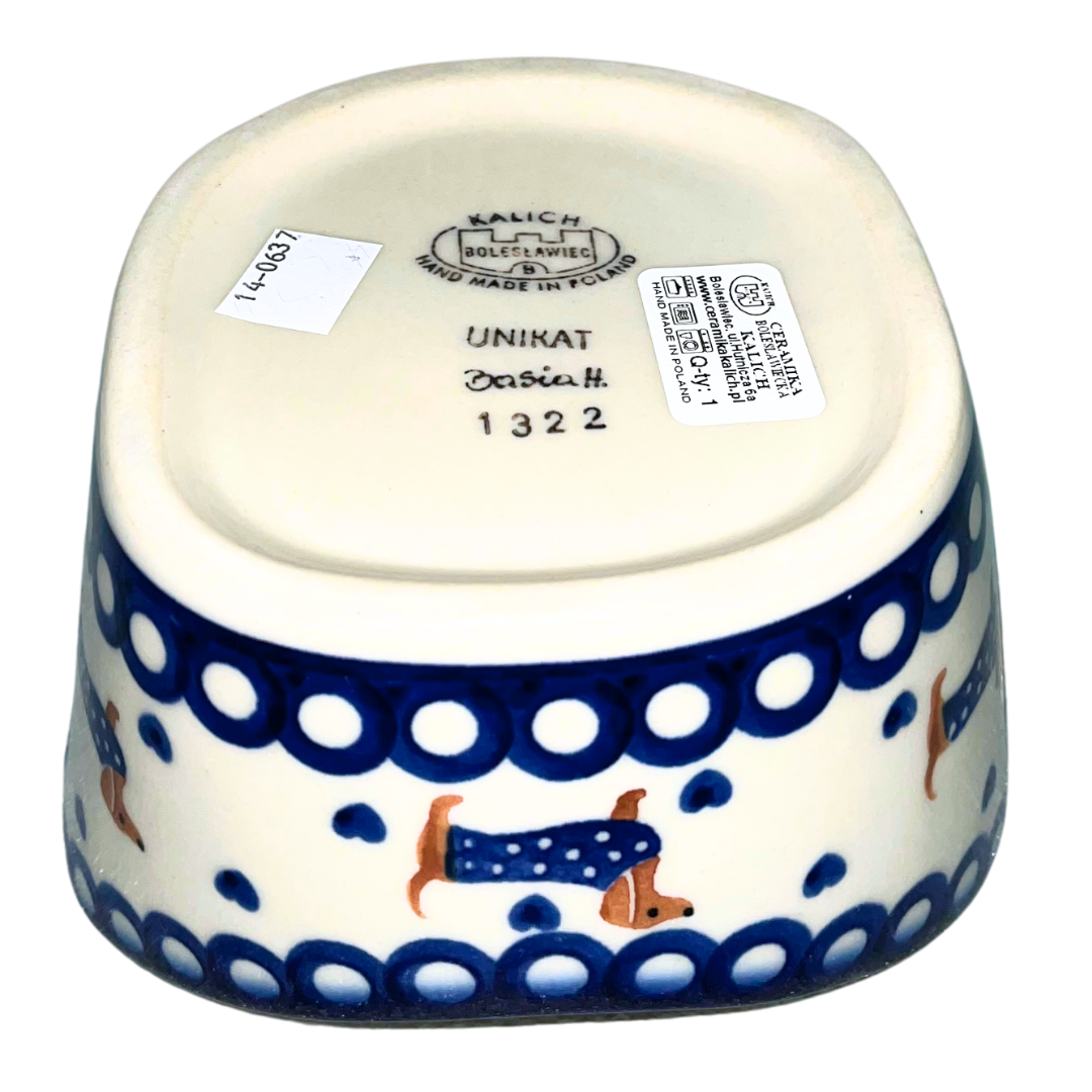 Ceramika Kalich Pattern 1322 Dachshunds features playful dachshunds in blue coats with scattered blue hearts and cobalt accents. Hand-painted Polish pottery from Poland.