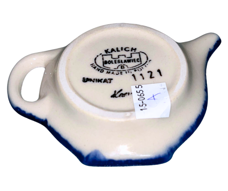 Tea Bag Rest featuring a whimsical gingerbread house adorned with peppermint swirls, candy canes, colorful gumdrops, and snowy icing details.