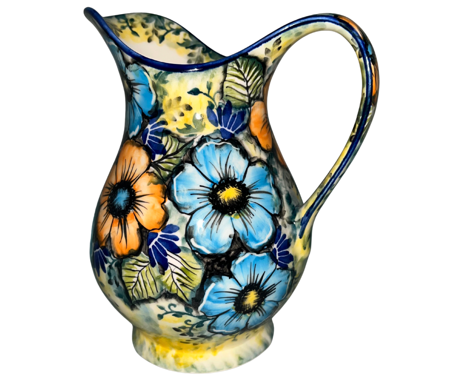 Limited Edition 2025 30 oz Kaola pitcher, hand-painted and signed by Aga K. in Bolesławiec, Poland. Vibrant blue and orange florals on luminous yellow glaze.