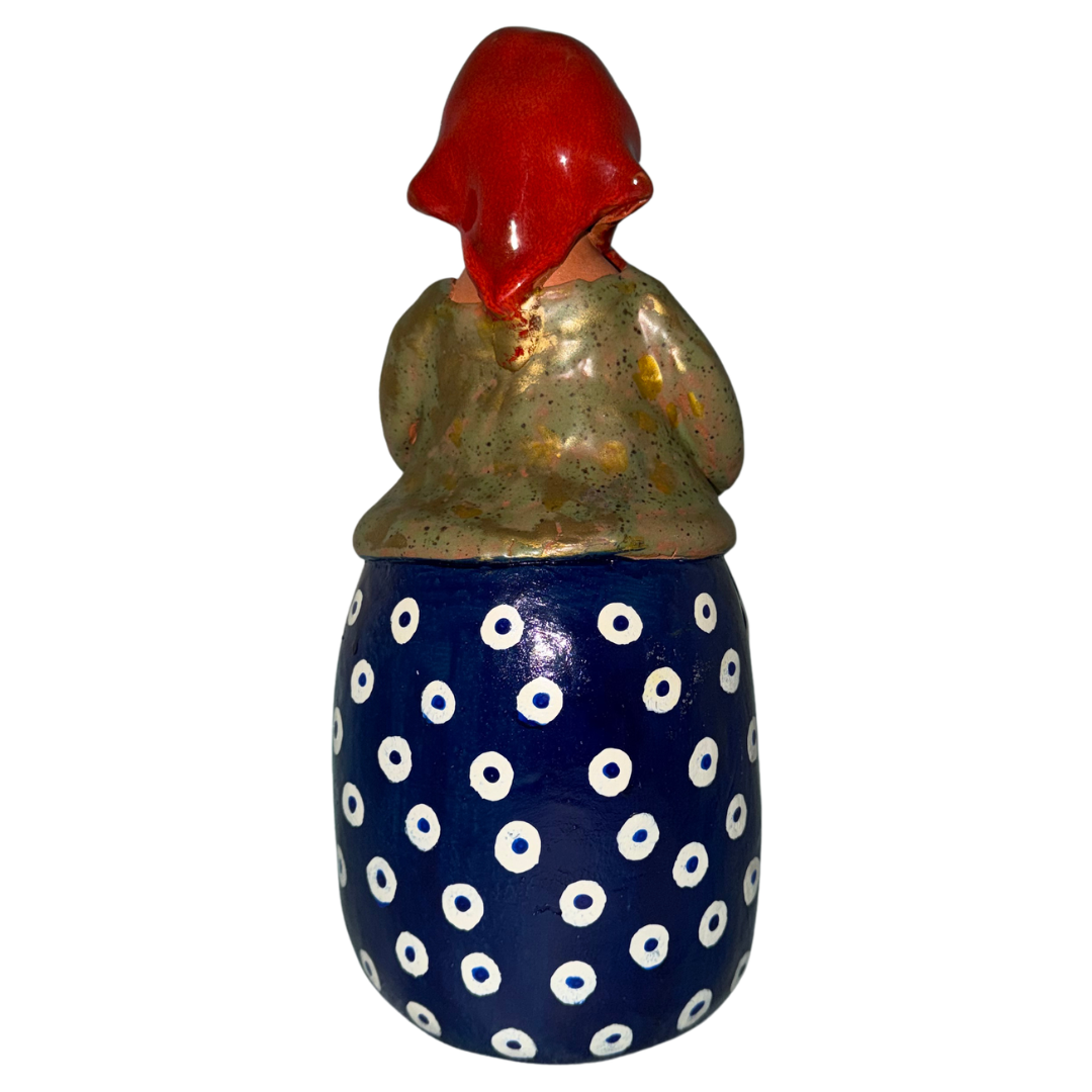 Hand-painted handcrafted babcia figurine holding a bowl of pierogi.