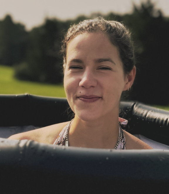 Woman in inflatable pool outdoors