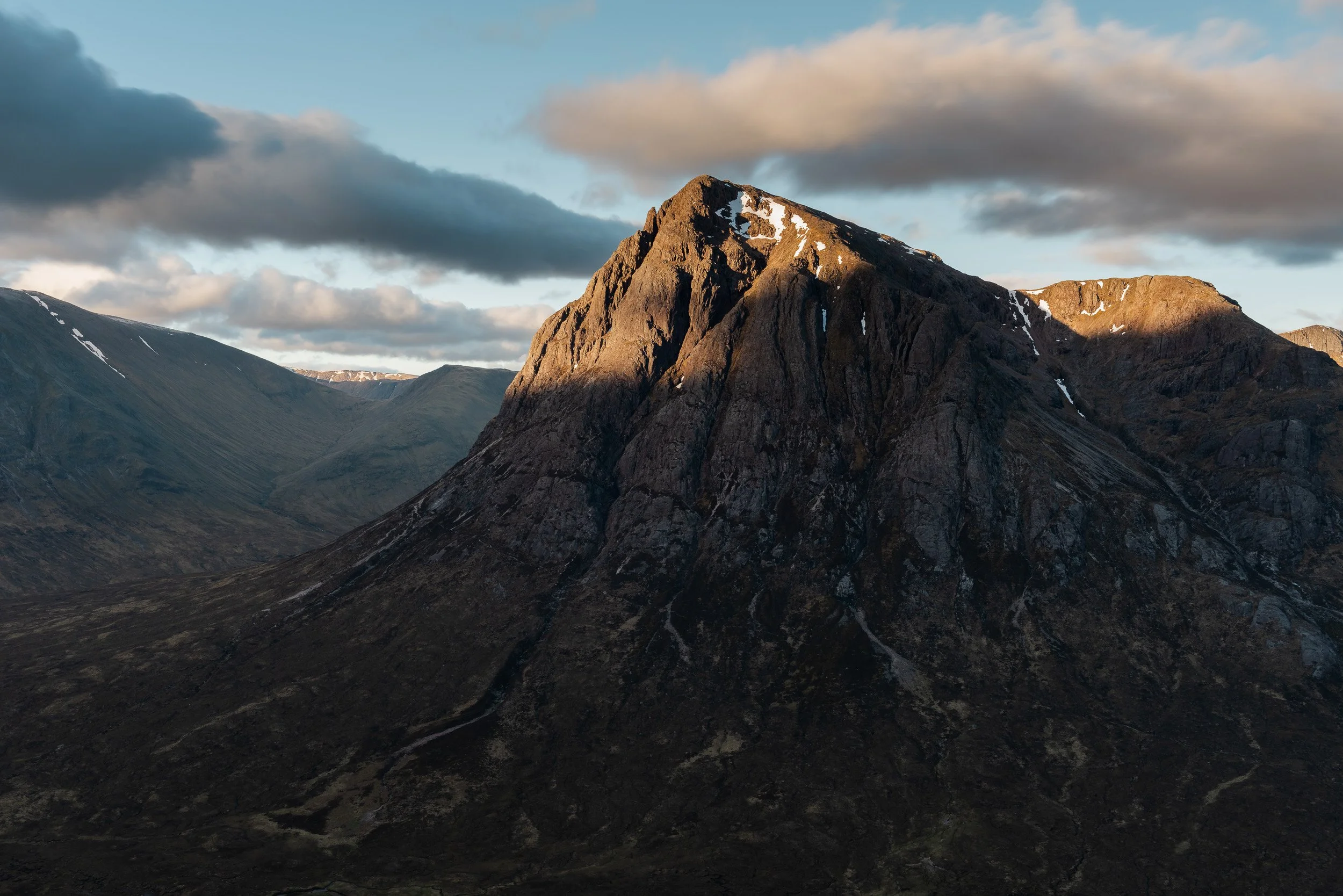 The features of Curved Ridge, Crowberry Tower and the north buttress of Buachaille Etive Mòr lit up by the morning sun in the West Highlands of Scotland. Image © Colin Henderson Photography. Permission required before use. To license this image, plea