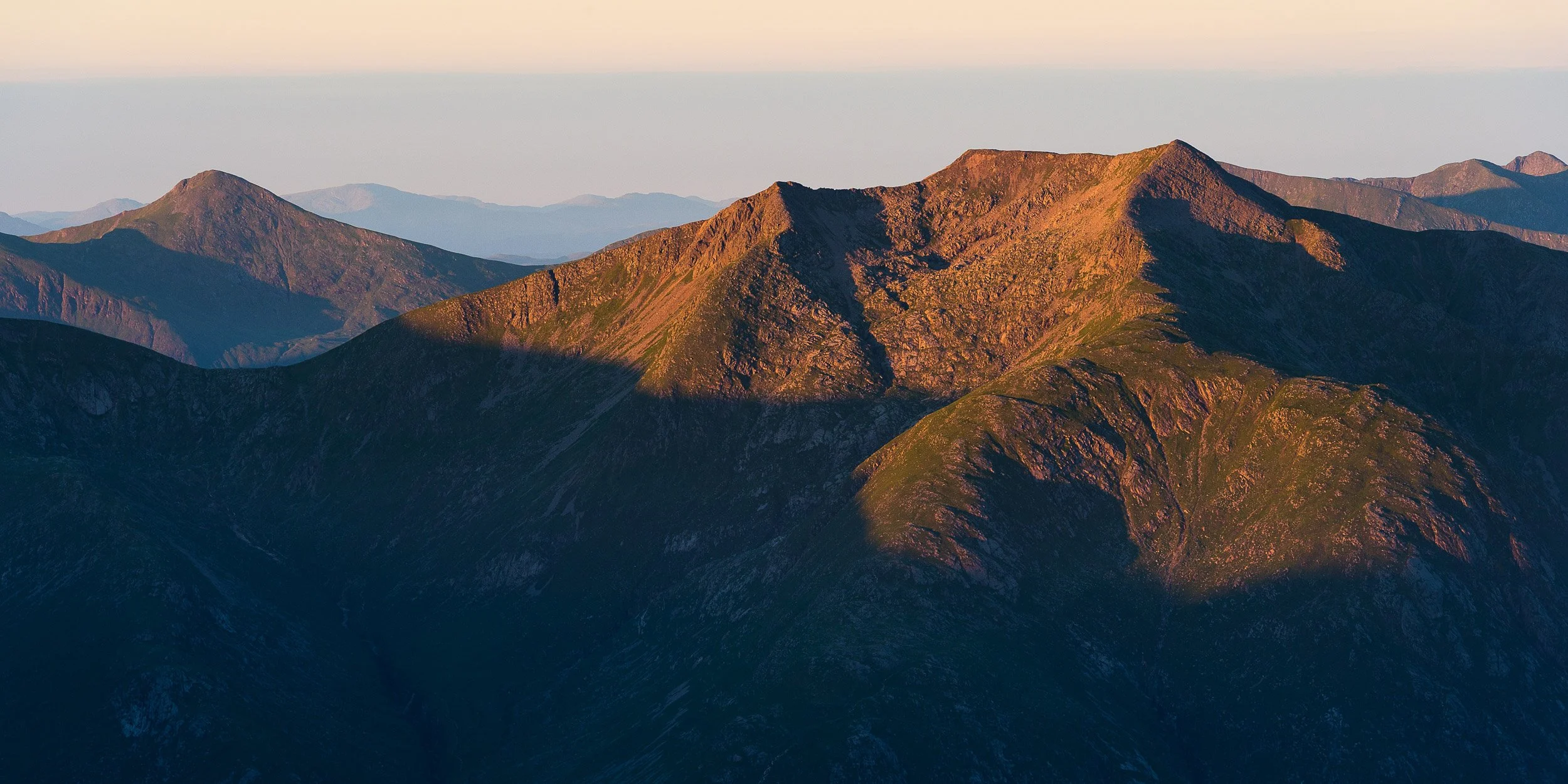 Sunrise on the ridges and summit of Ben Starav, a Munro in the West Highlands of Scotland.