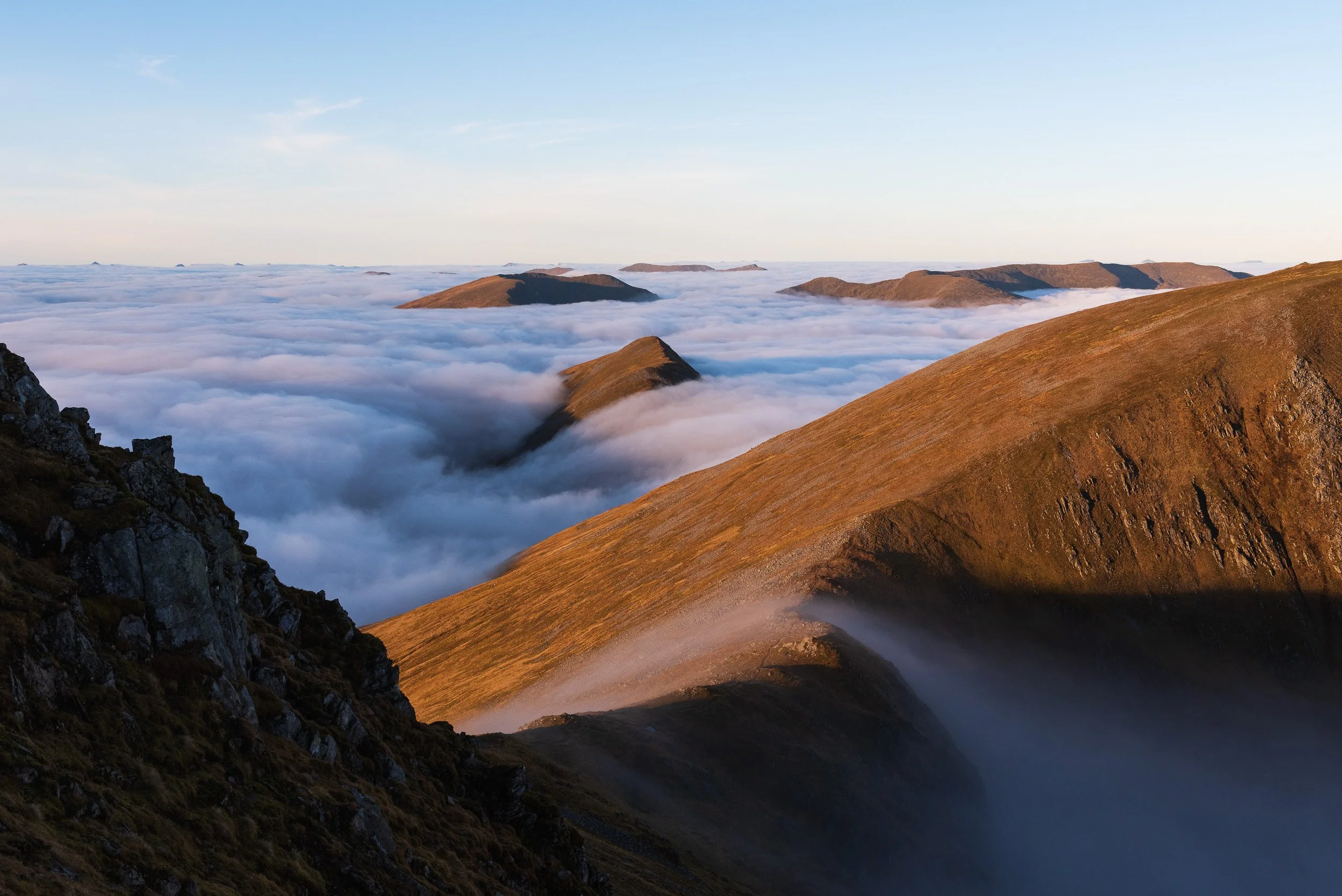 A cloud inversion surfaces Beinn Fhionnlaidh and the Mullardoch hills behind Mam Sodhail, a Munro above Glen Affric in the North-West Highlands of Scotland. Image © Colin Henderson Photography. Permission required before use. To license this image, p