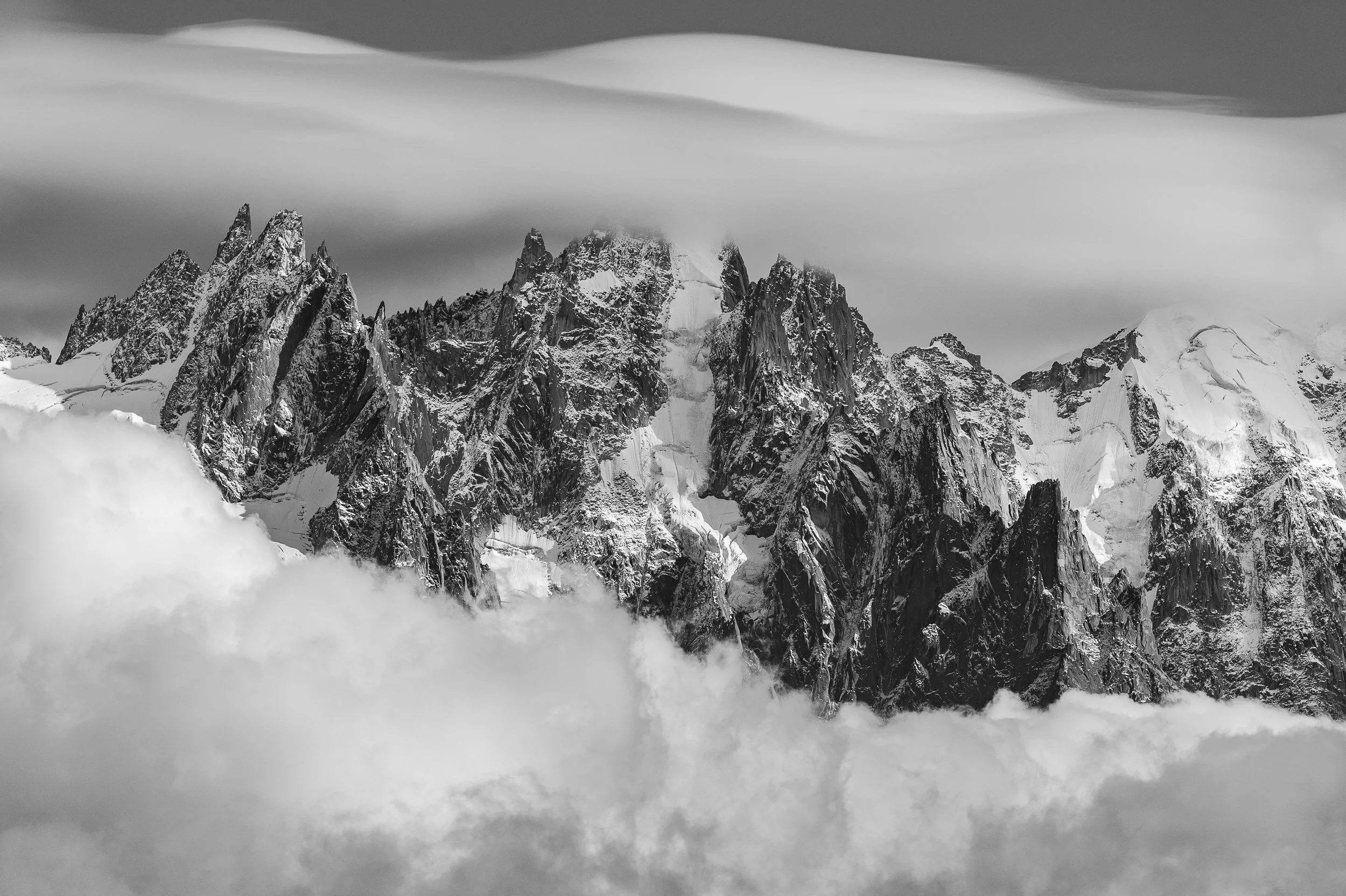 Clouds surrounding Aiguille de Blaitière, Dent du Caïman (Dent du Crocodile), Aiguille du Plan, Aiguille des Pélerins above Chamonix, France. Image © Colin Henderson Photography. Permission required before use. To license this image, please contact m