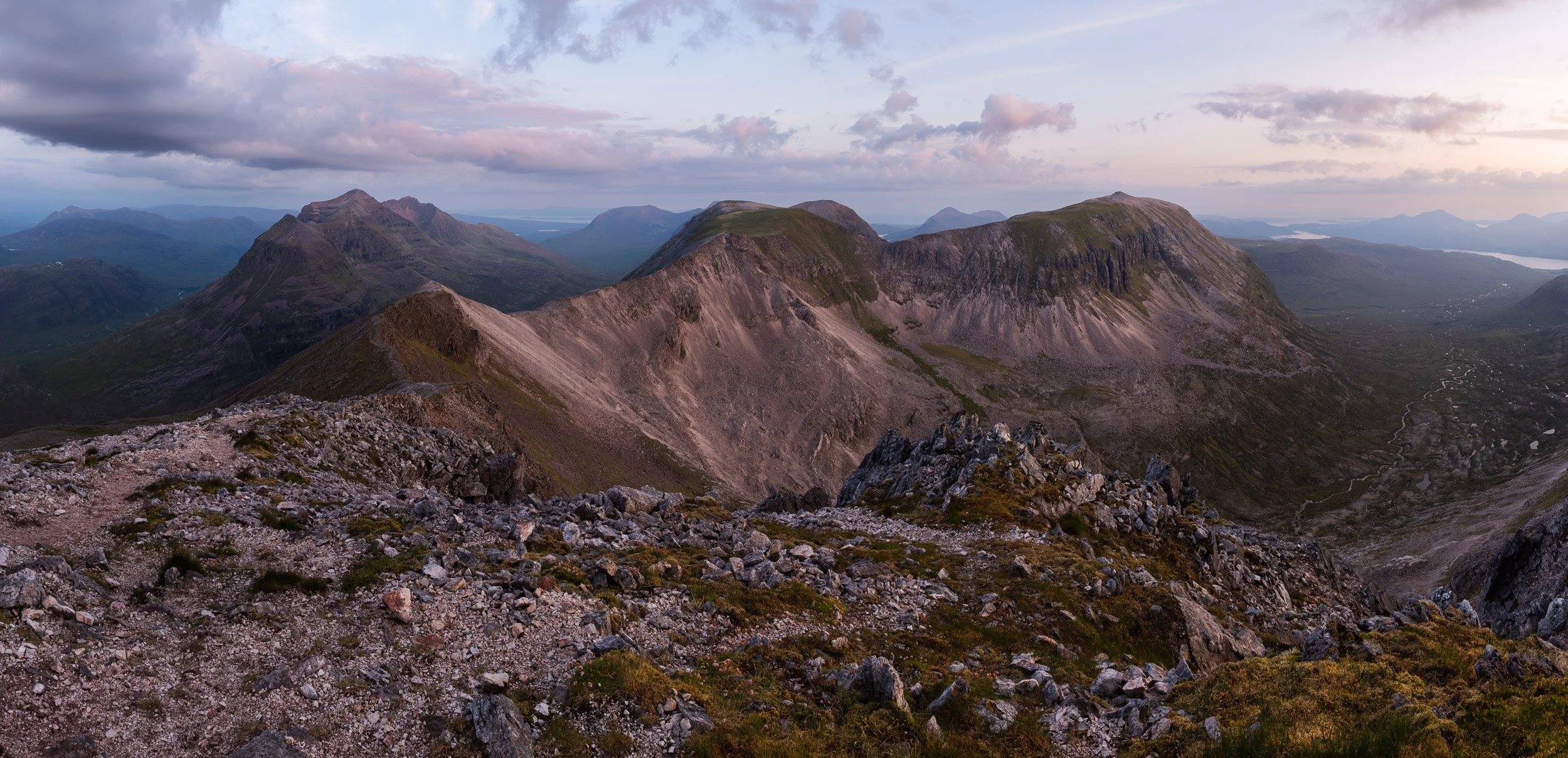 Looking west at dawn from Spidean Coire nan Clach on Beinn Eighe towards Liathach and Ruadh-stac Mòr in Beinn Eighe National Nature Reserve, Scotland