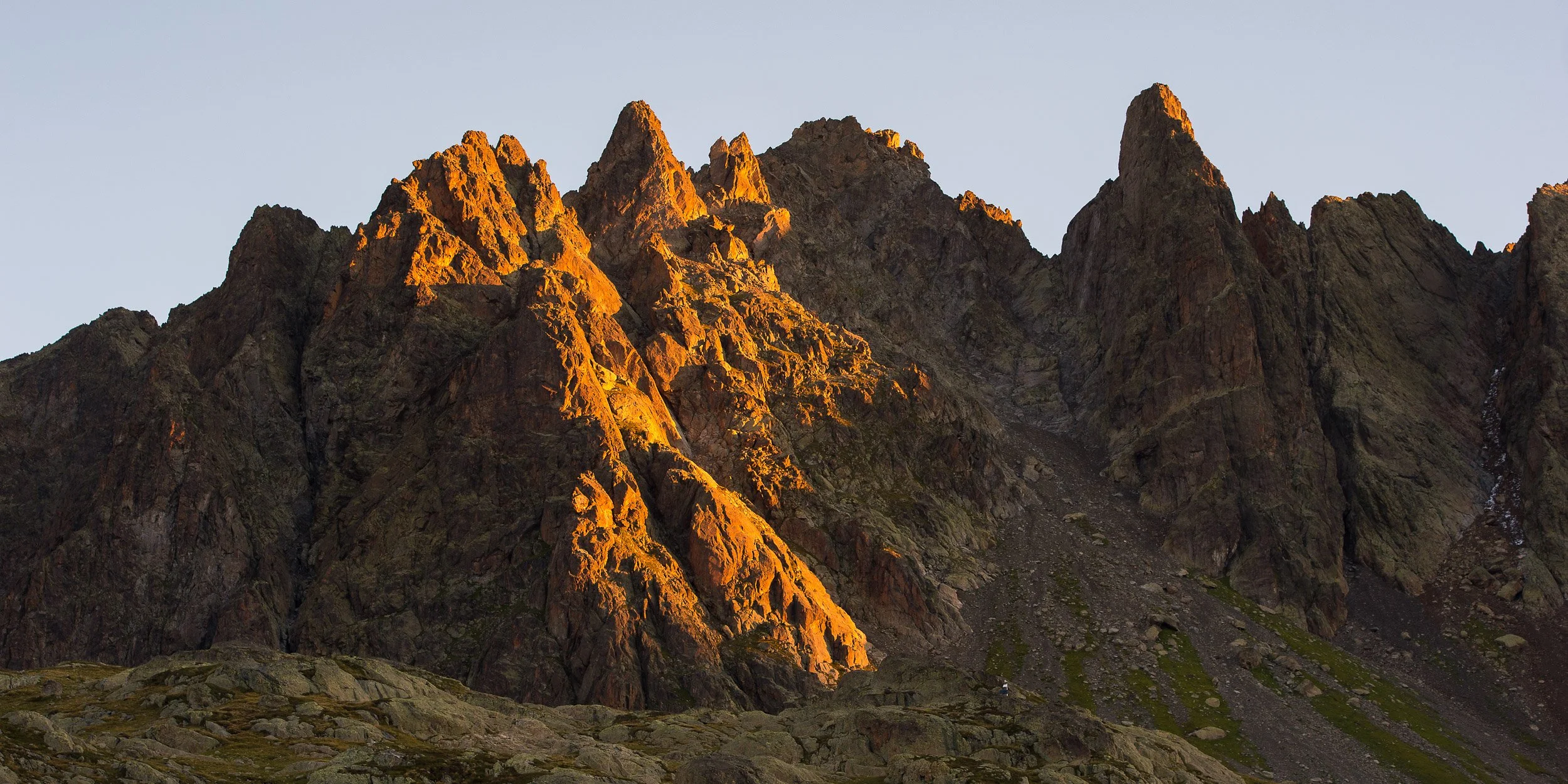 Sunrise catches the rocks of Sunrise catches the rocks of Aiguilles Rouges above Chamonix in France. Image © Colin Henderson Photography. Permission required before use. To license this image, please contact me quoting the file reference, size requir
