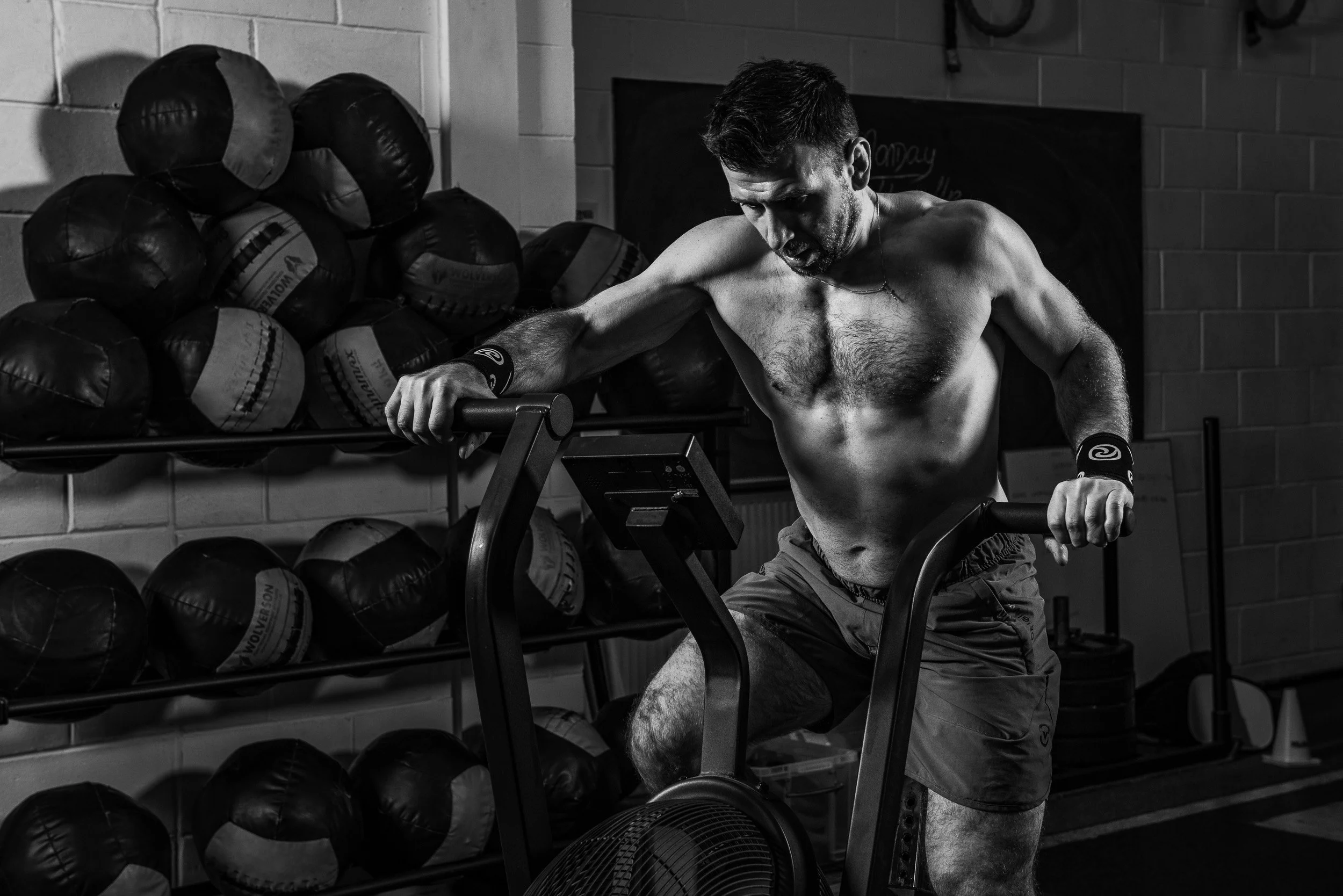 Alexander (Sasha) Voronov cycling at CrossFit Skirmish gym in Edinburgh. Image © Colin Henderson Photography. Permission required before use. To license this image, please contact me quoting the file reference, size required and your planned end usag