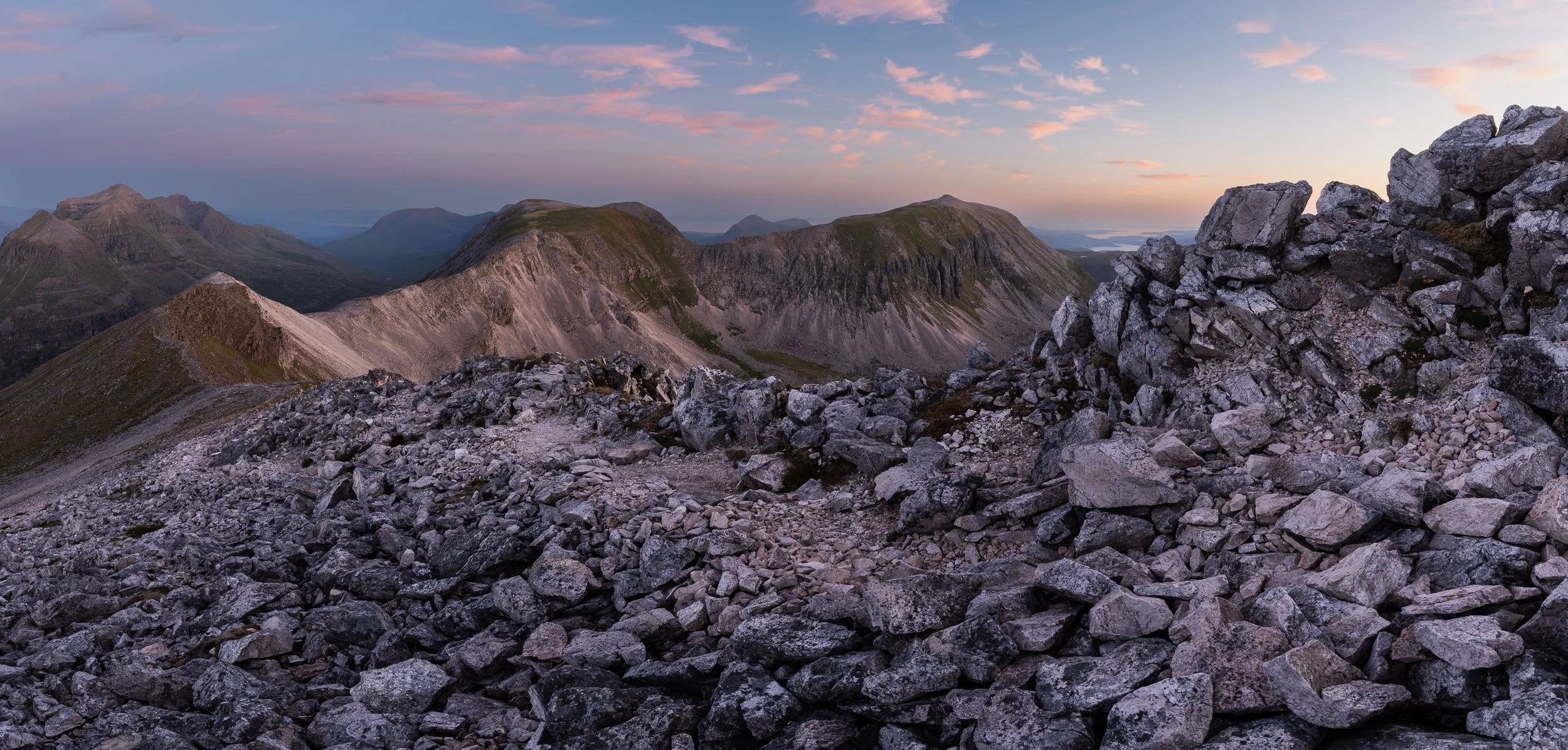Dawn light on the rocky ridge between Spidean Coire nan Clach on Beinn Eighe towards Coinneach Mhor and Ruadh-stac Mòr in the North-West Highlands of Scotland. Image © Colin Henderson Photography. Permission required before use. To license this image