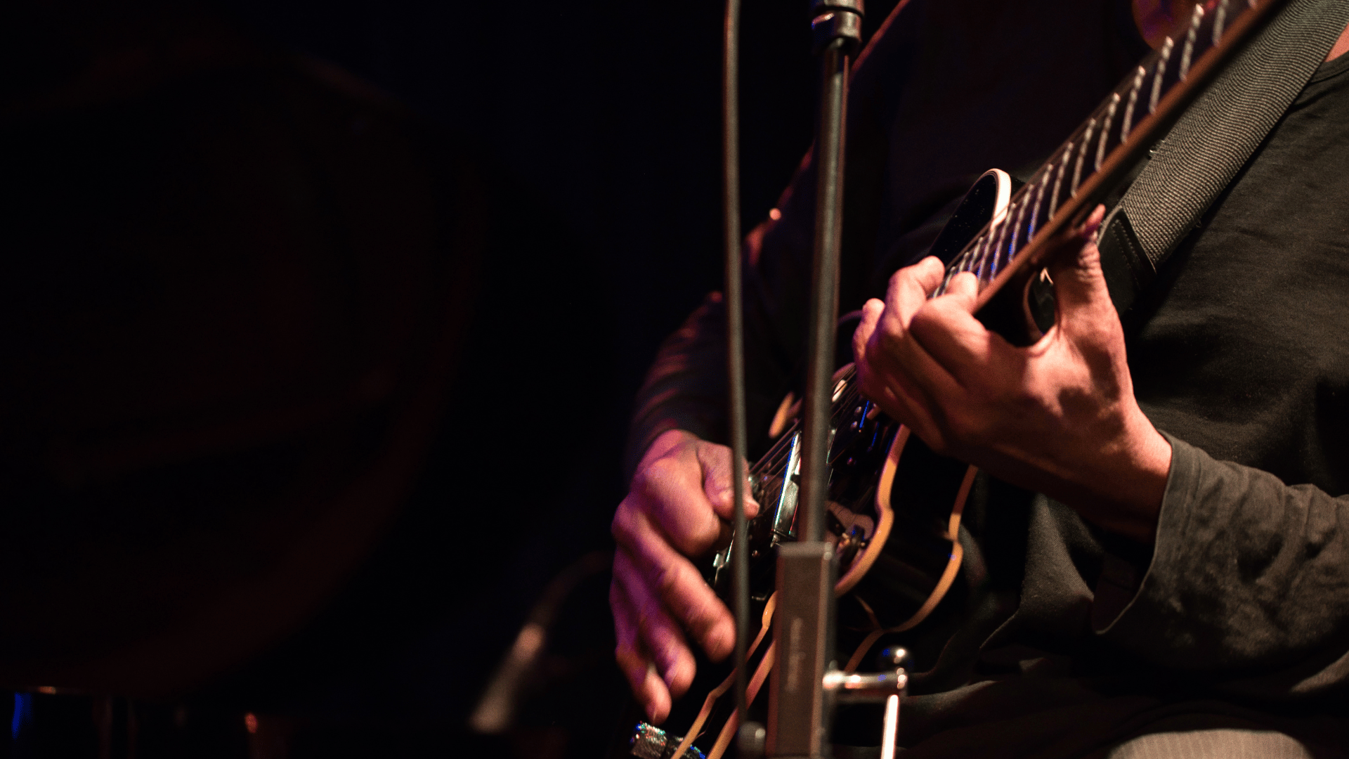 funk musician playing guitar