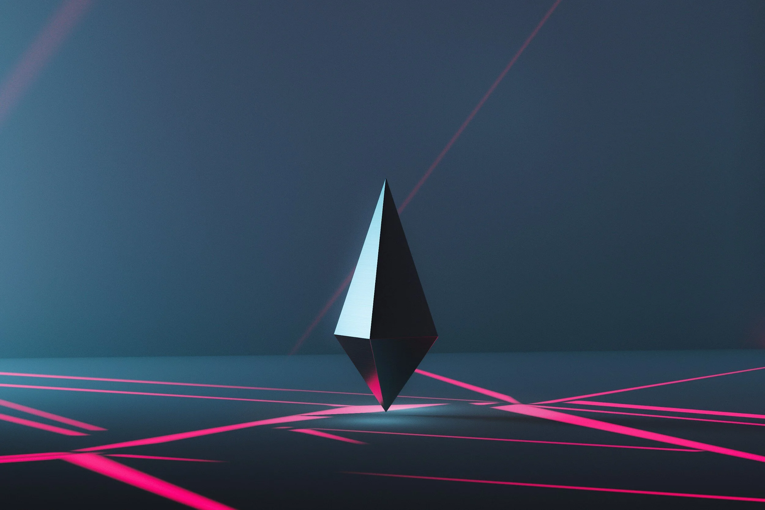A digital rendering of a stylized diamond-shaped object with a reflective surface, floating above a dark surface with pink laser lines crossing underneath, against a dark blue background with faint laser beams.