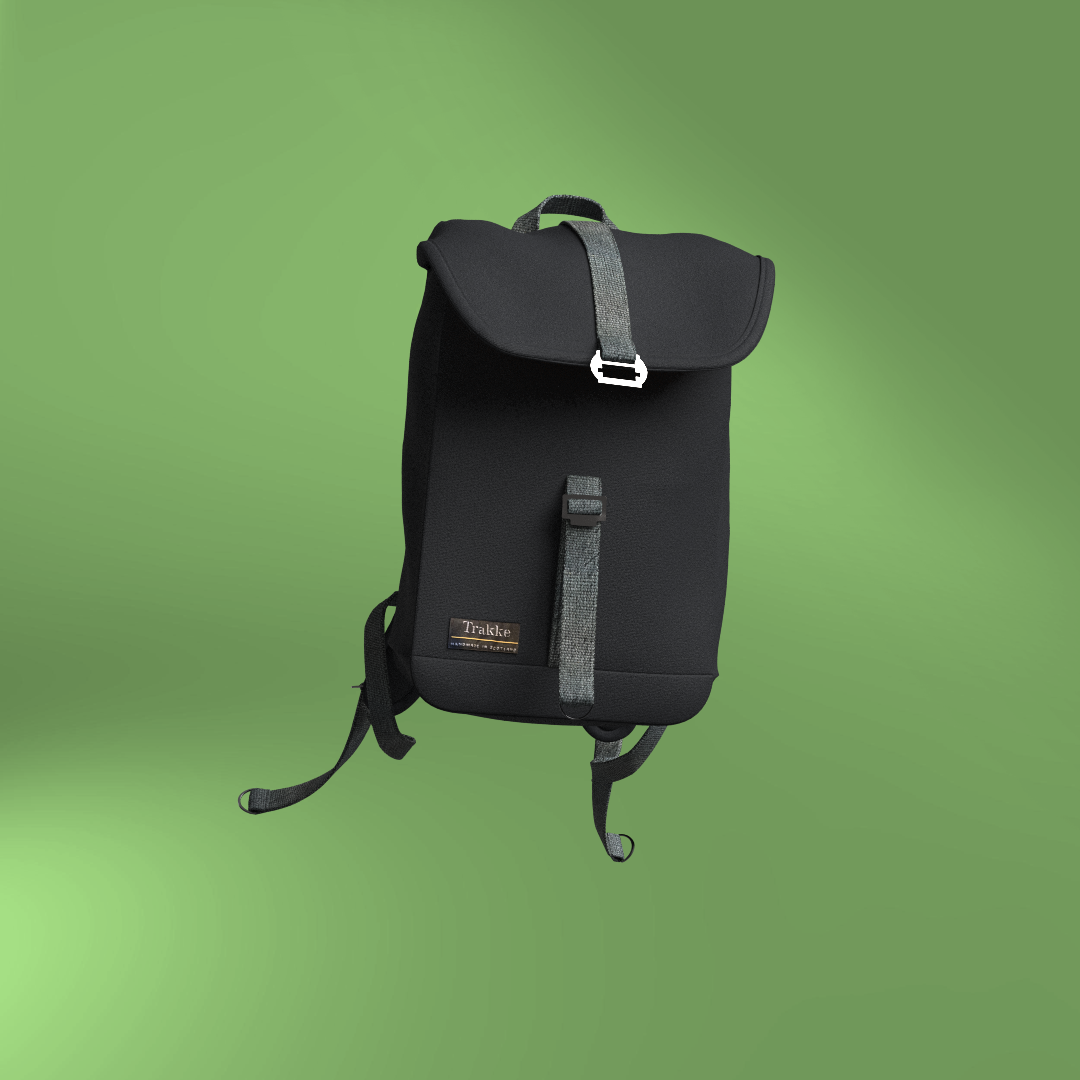 Still render in Clo3D of a digital twin of a Trakke Arkaig backpack. The background is green, and the bag is black, and has a black strap closure on the top flap with a metal custom clasp.