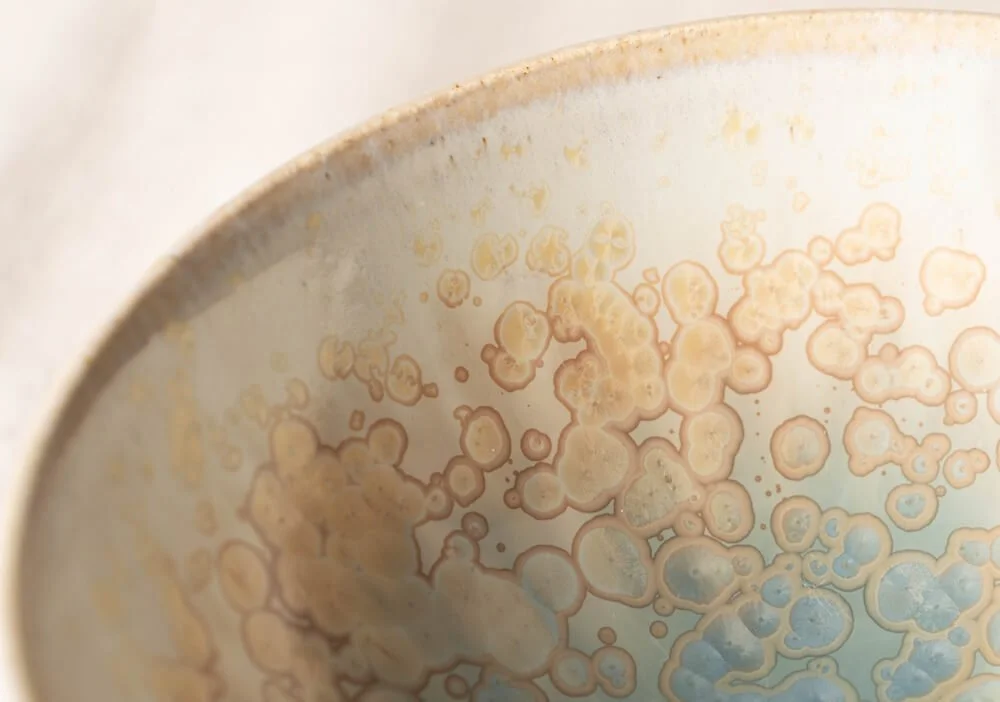 Interior-of-bowl-showing-close-up-details-of-gold-pink-and-blue-crystals-growing