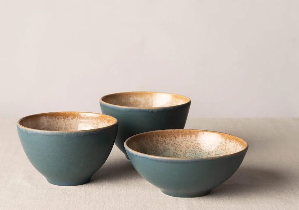 Handmade-wheel-thrown-bowl-with-matt-blue-and-gold-crystals