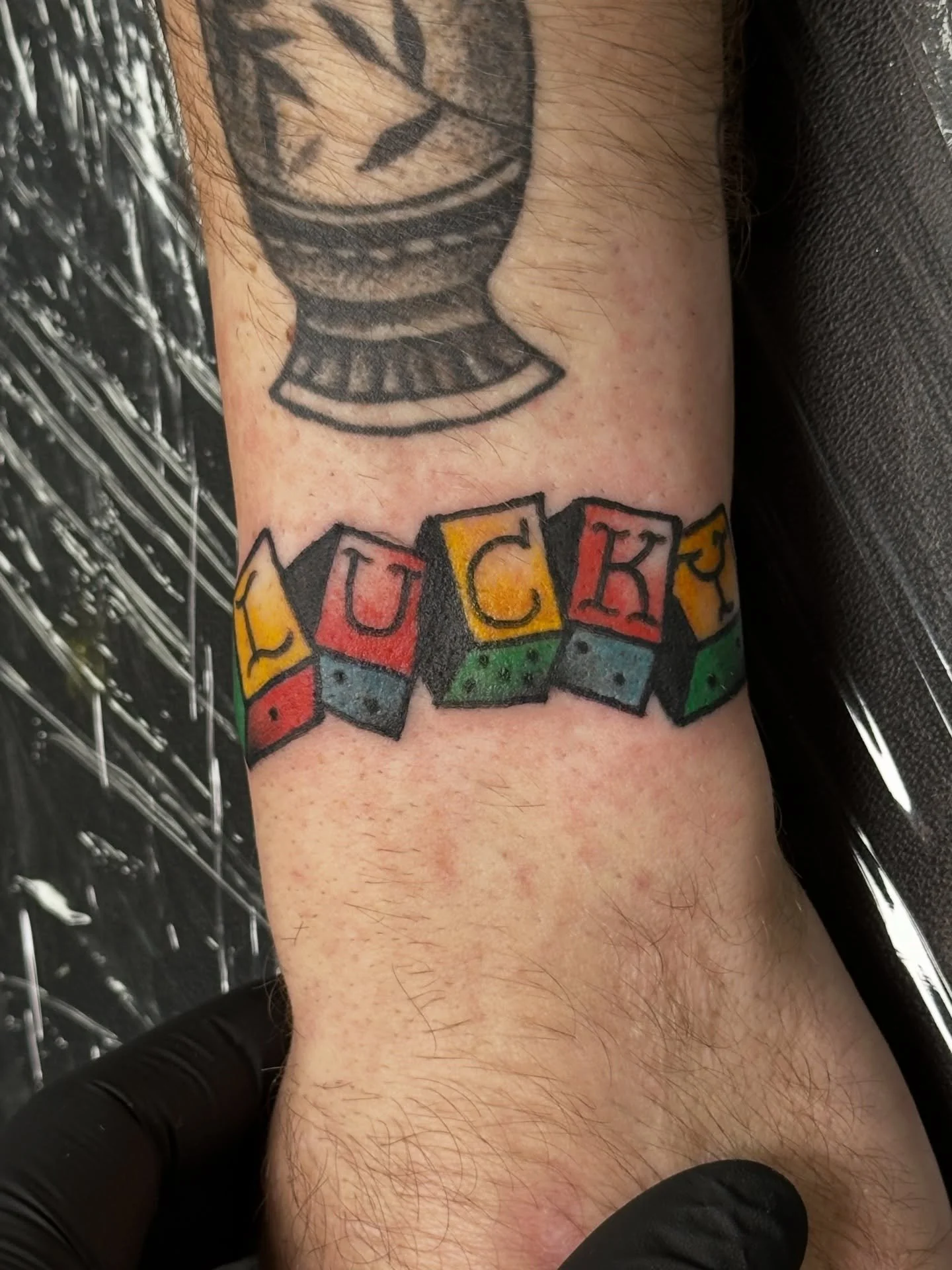 From my flash! We change the design a tad - room away some text, added a 5th dice, and changed the numbers on the dice to represent the Gotcha Day of his late cat ❤️
-
-
-
Let&rsquo;s tattoo! DM or email tatt2k215@gmail.com