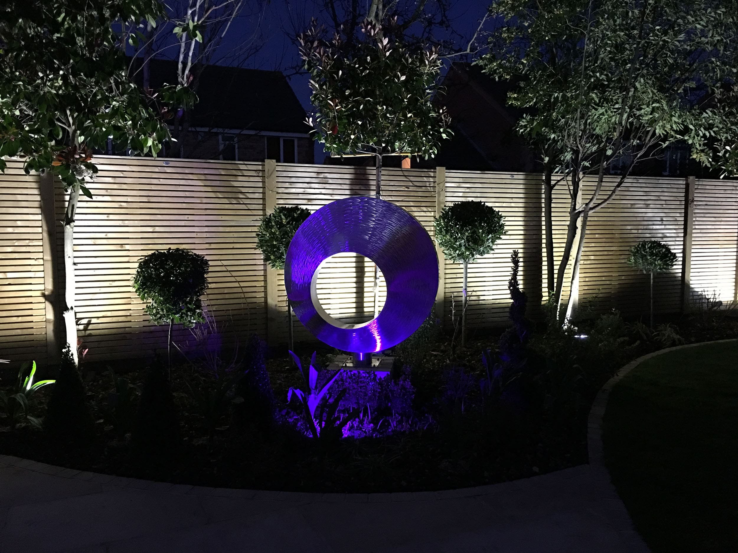 orbital-stainless-steel-garden-sculpture-night.jpg