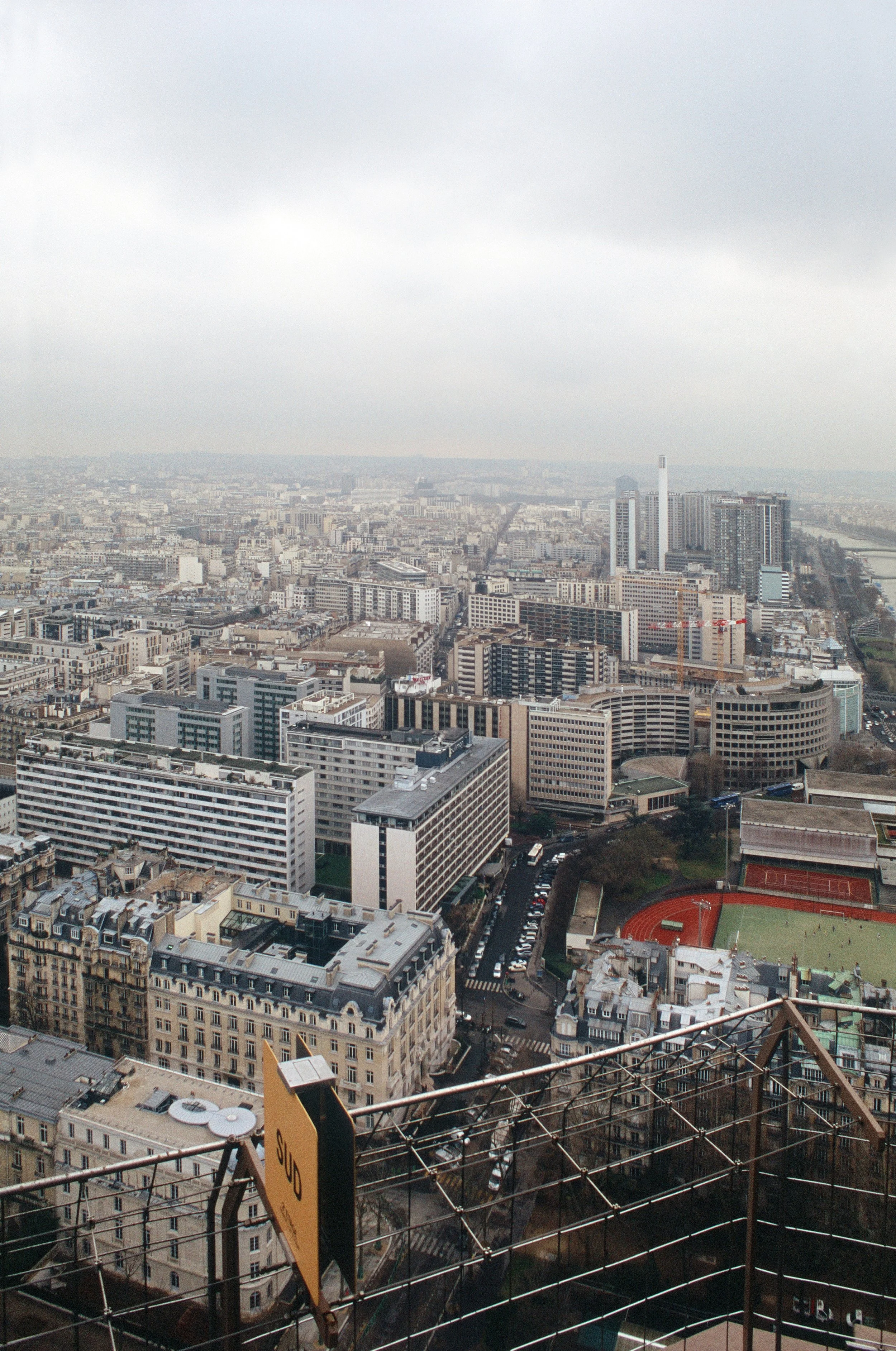 Aerial view across Paris cityscape with high-rise buildings taken from the eiffel tower