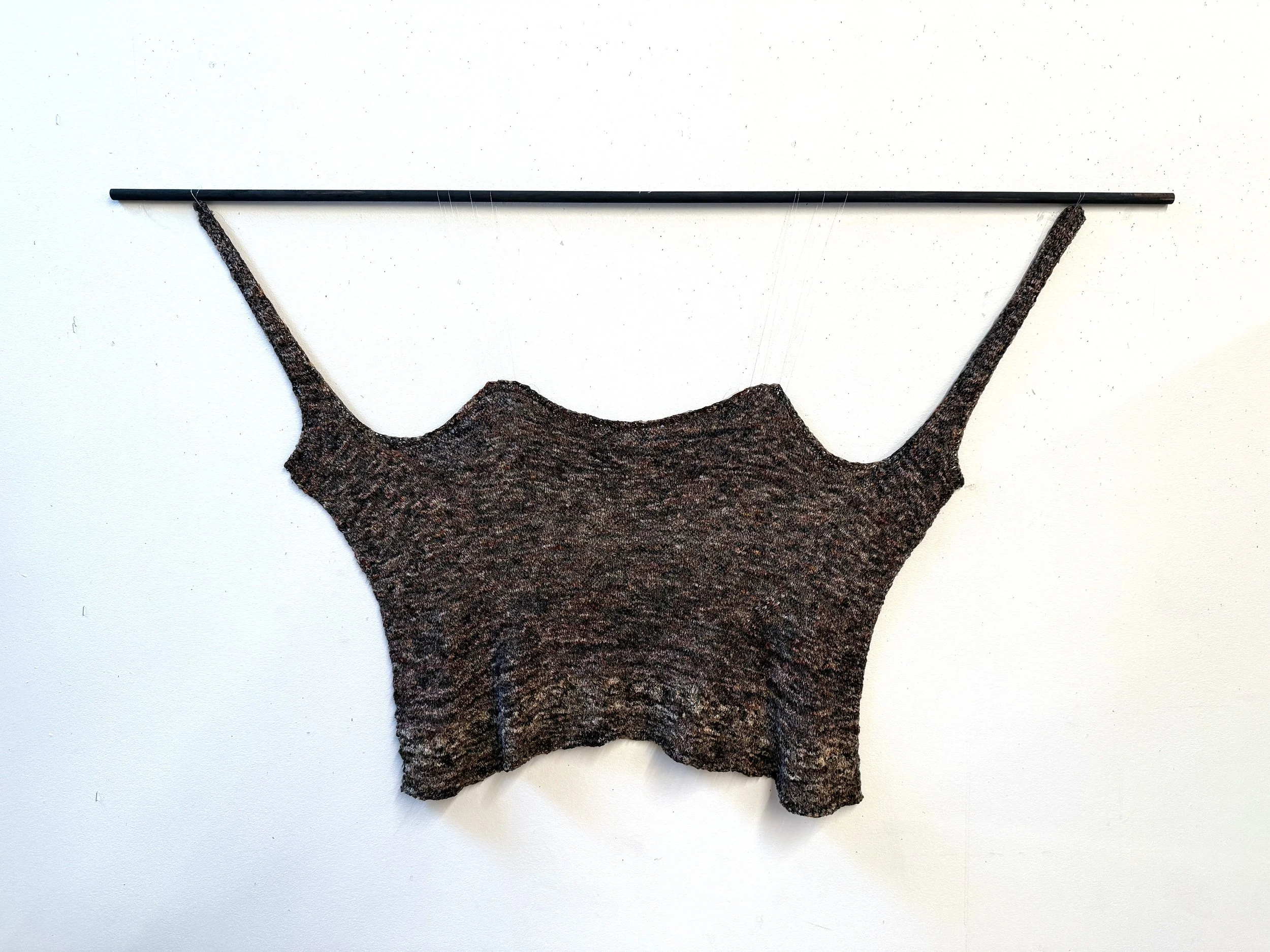"Hand Knit Stay." Bundle Dyed Silk Organza Tape yarn knit to the shape of an 1830s stay. Increases and decreases following the woven pattern. Buttonholes knit where grommets would be. Based on the 1830s Stays from Redthreaded.