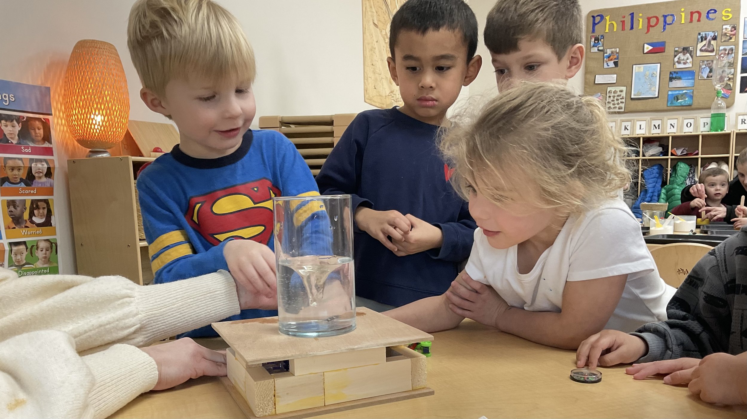 Kids around a beaker