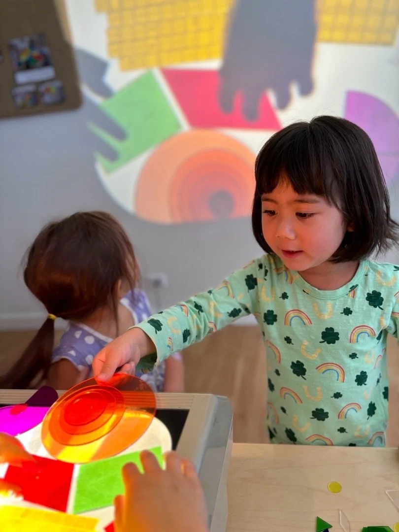 Kids playing with a projector.