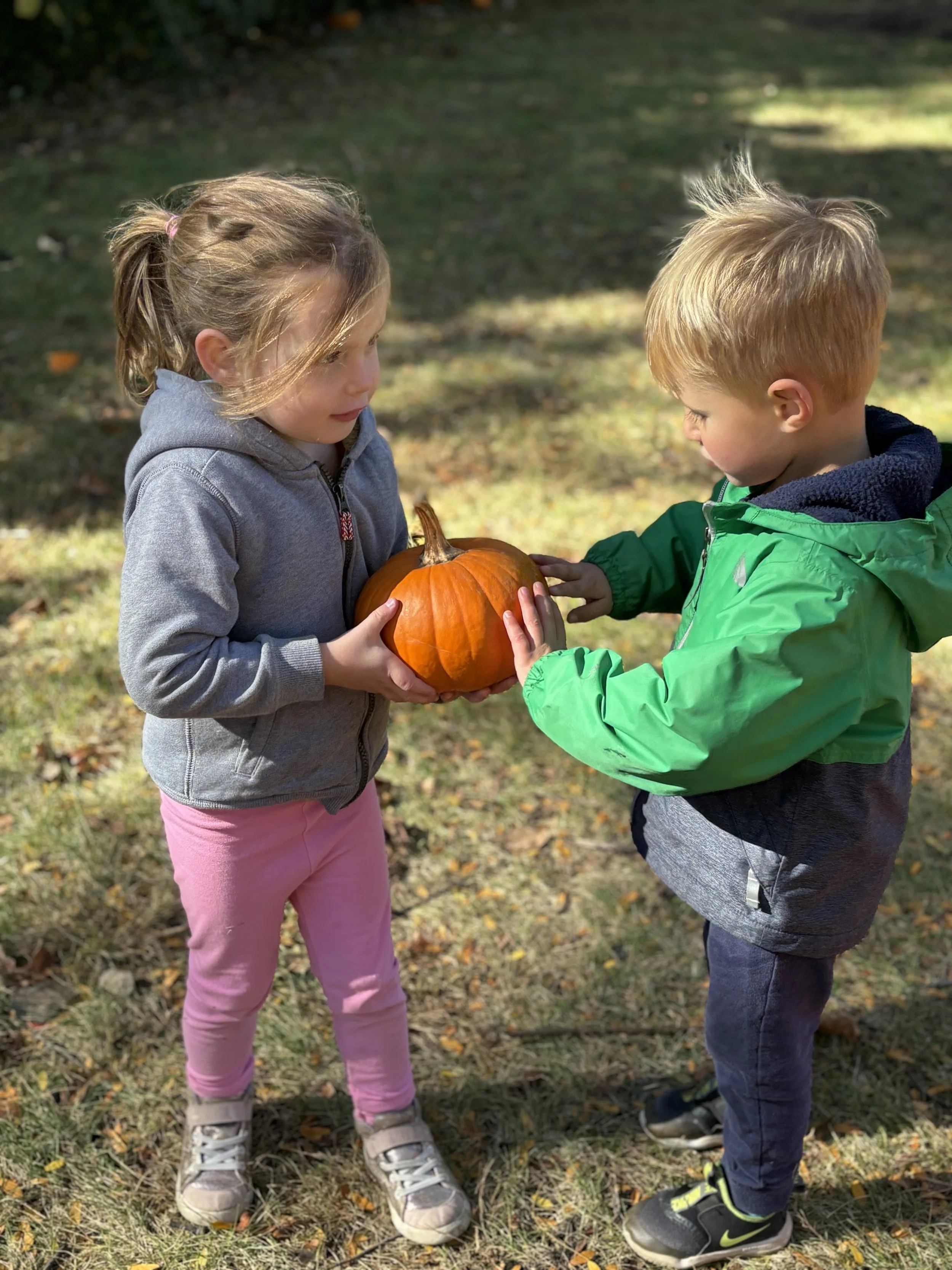 Two kids with a pumpkin