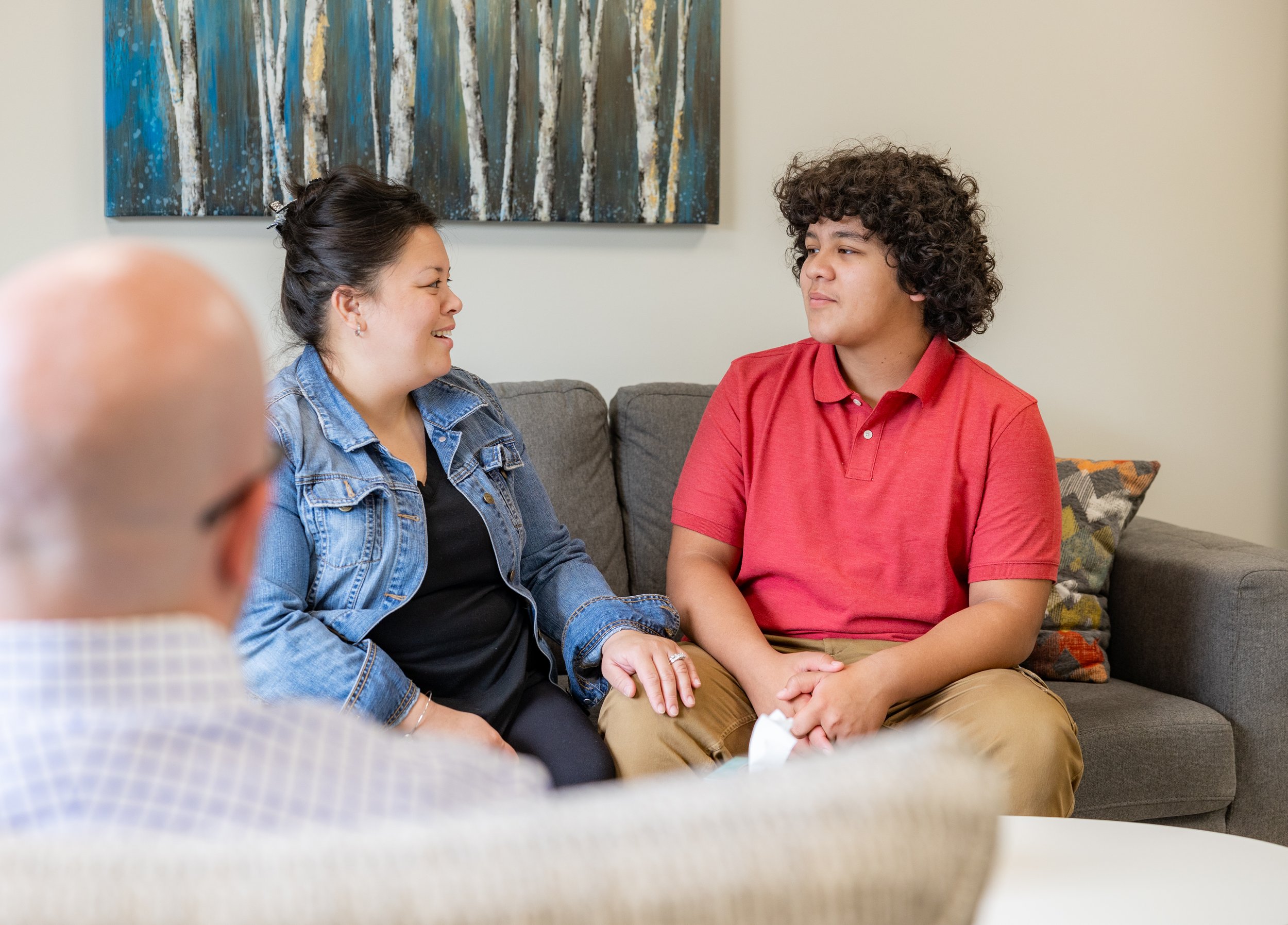 Mother and son on couch for family therapy