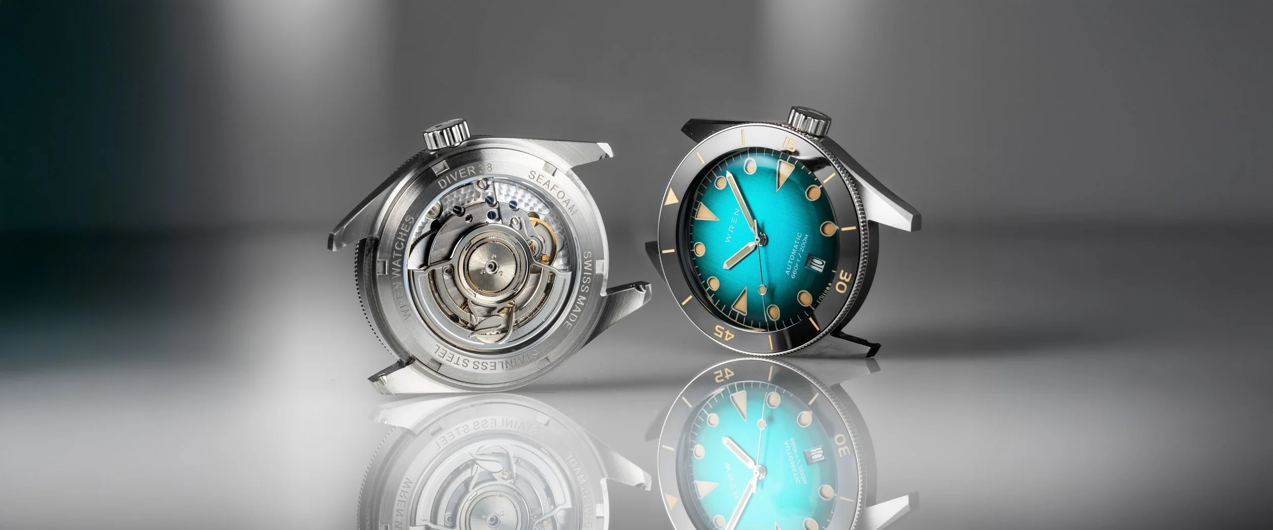 A Wren Diver 38 beside its ETA 2892-A2 movement, seen through the display caseback