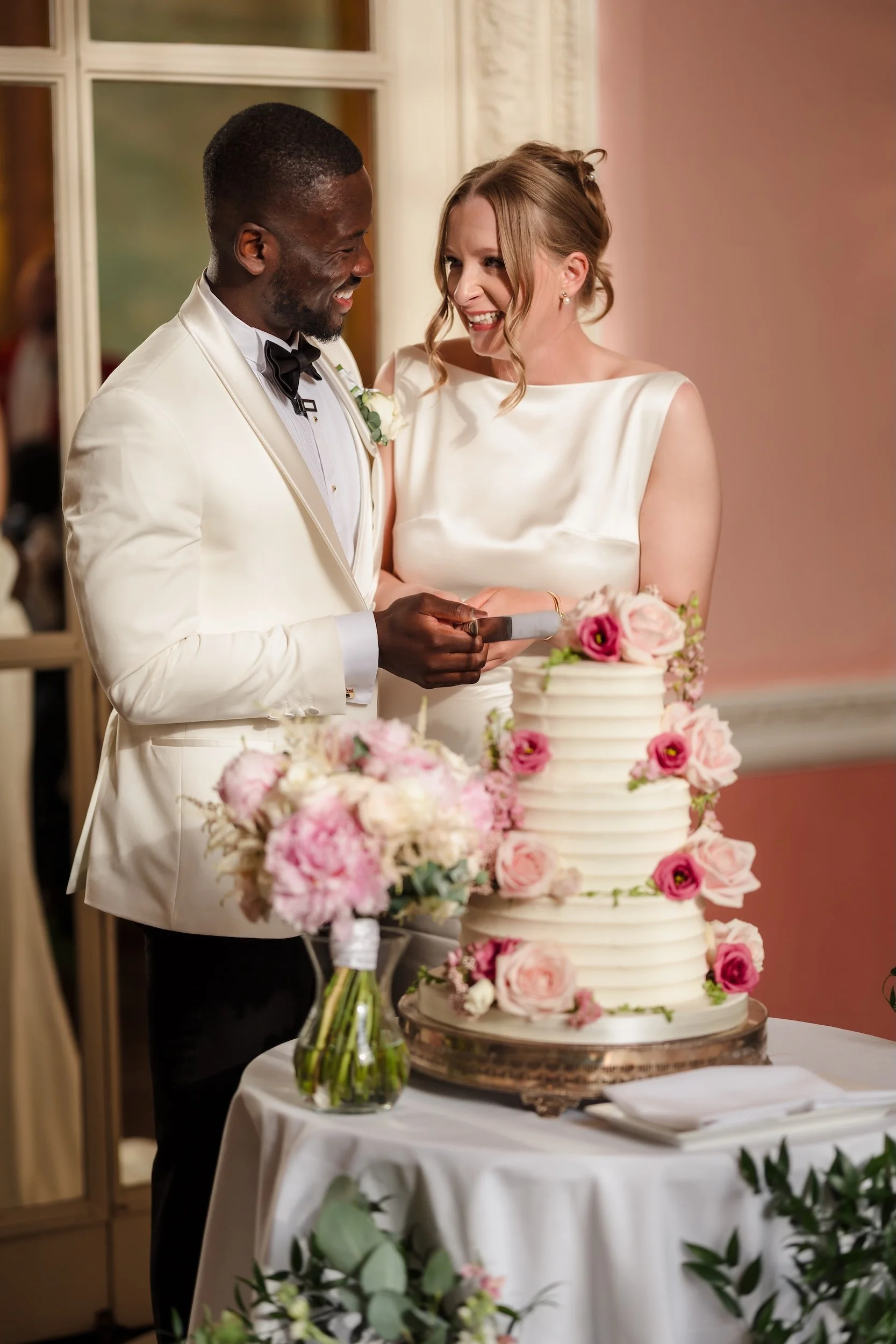 Bride and Groom Cutting the Cake Danesfield House Wedding.jpg