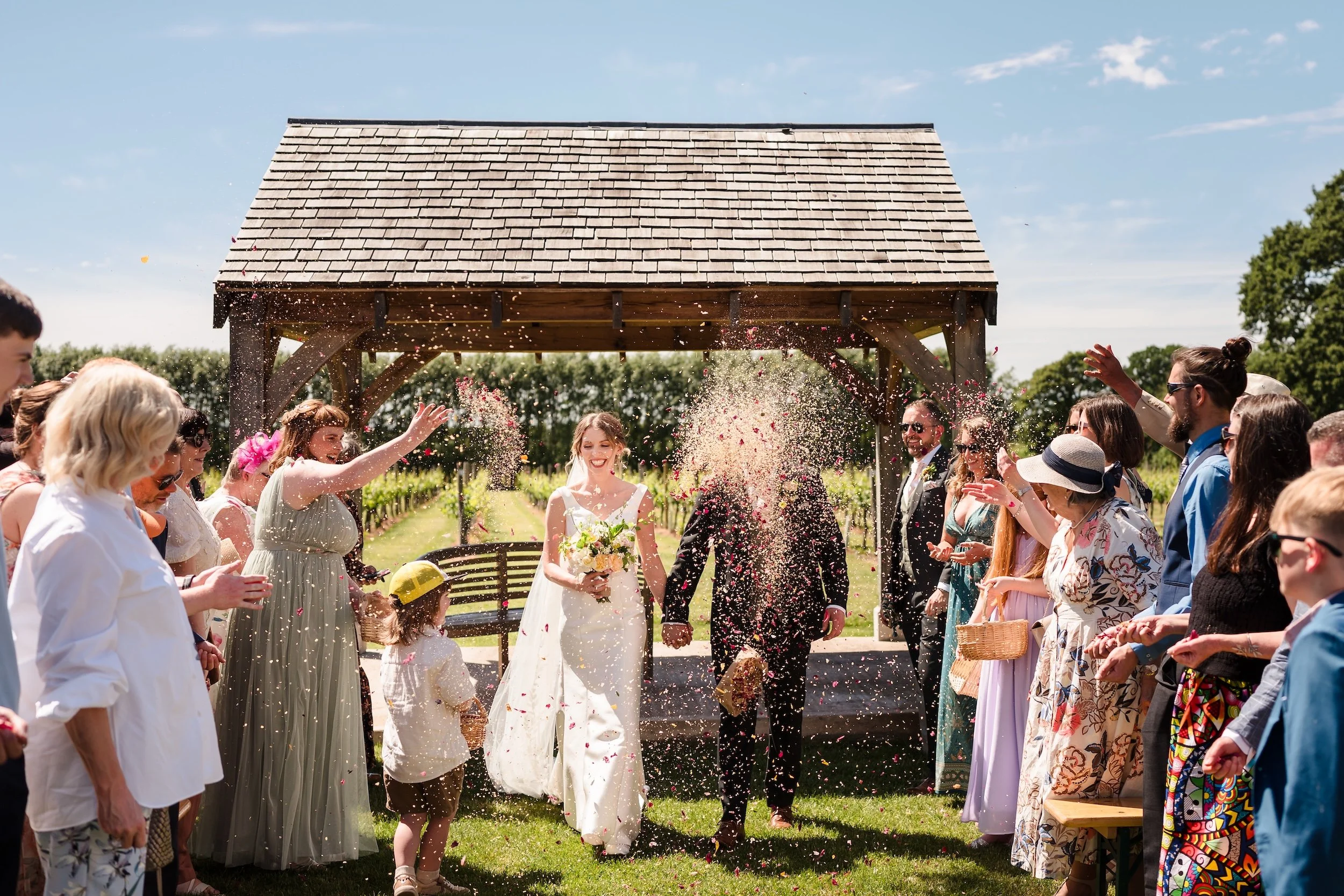 Bride_Groom_Confetti_Walk_Bristol_Wedding_Photography.jpg