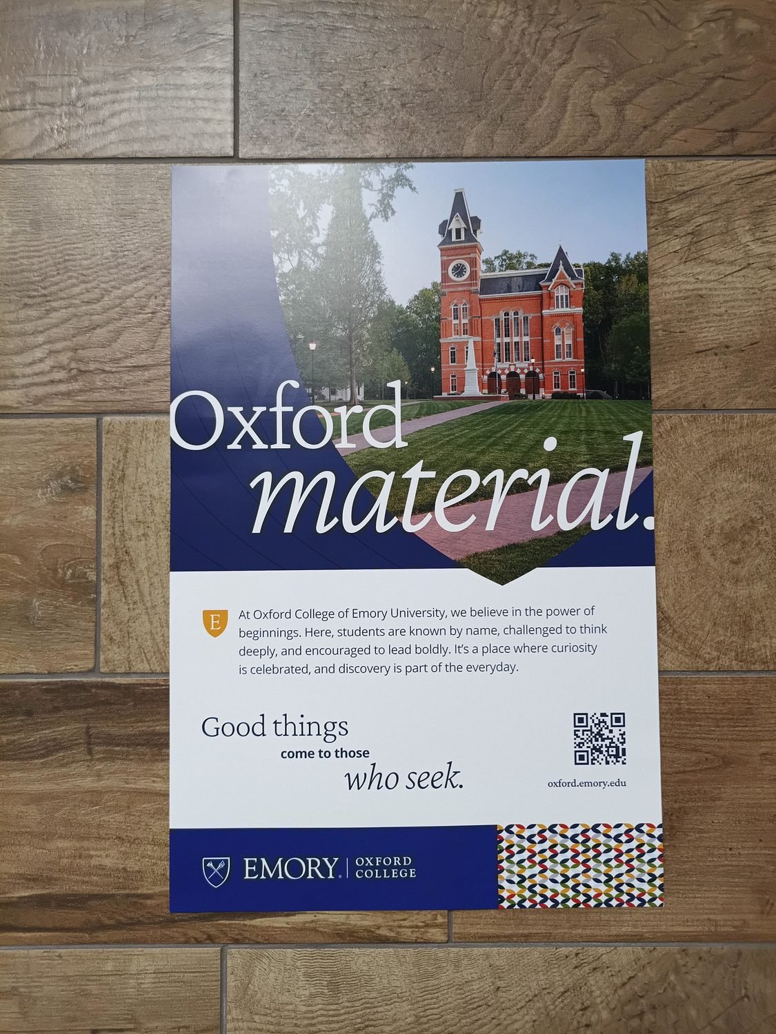 College recruitment poster on a wall in a high school hallway
