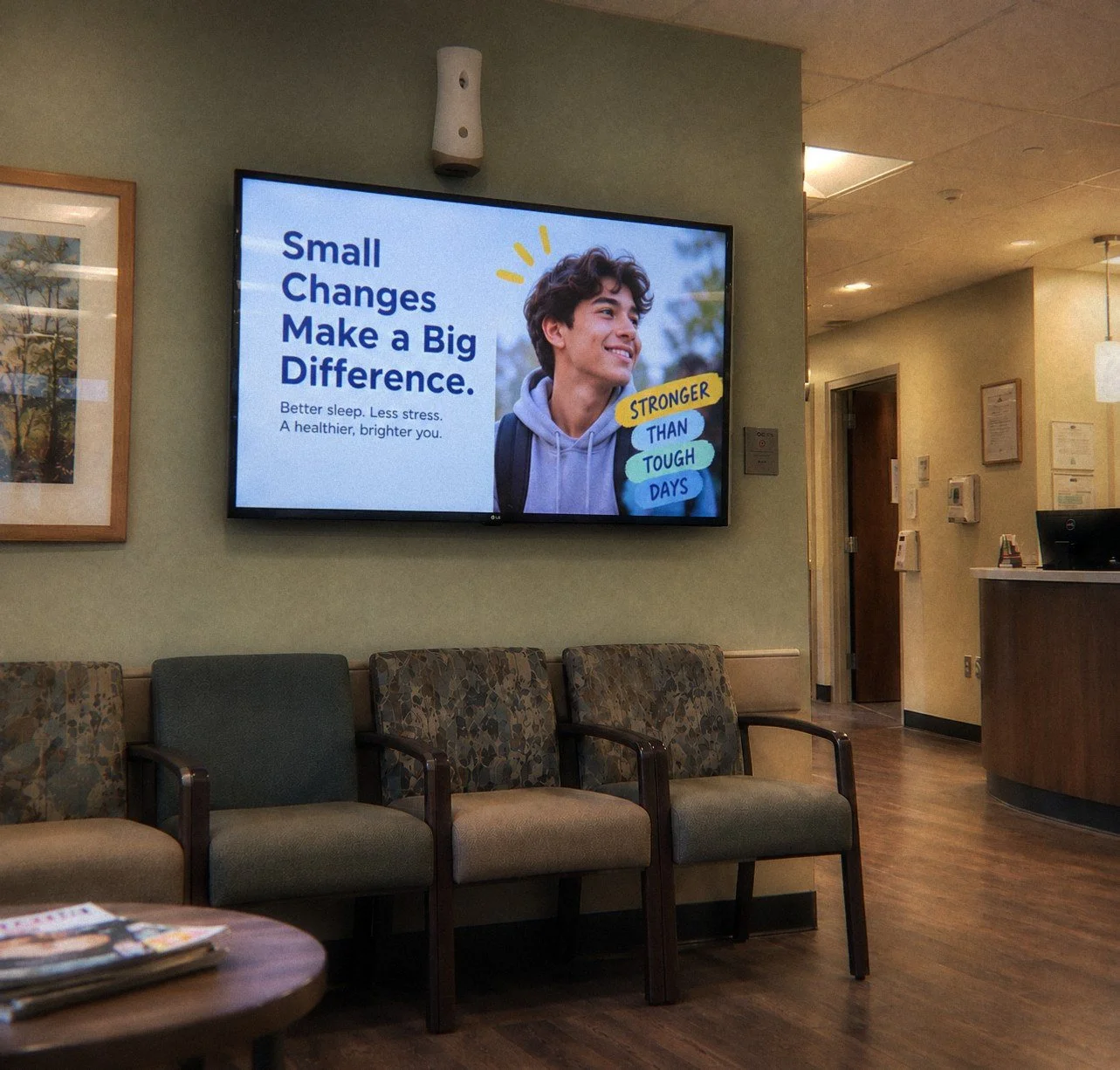 Clinic waiting room with a hopeful health message on a TV screen