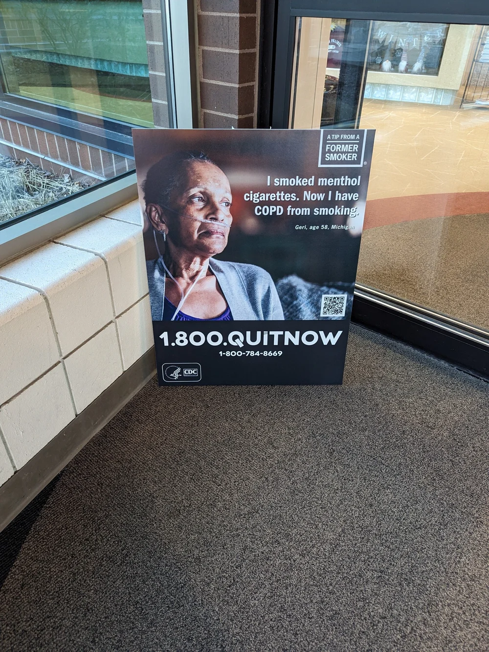 Quit smoking poster in a waiting area: 1-800-QUIT-NOW