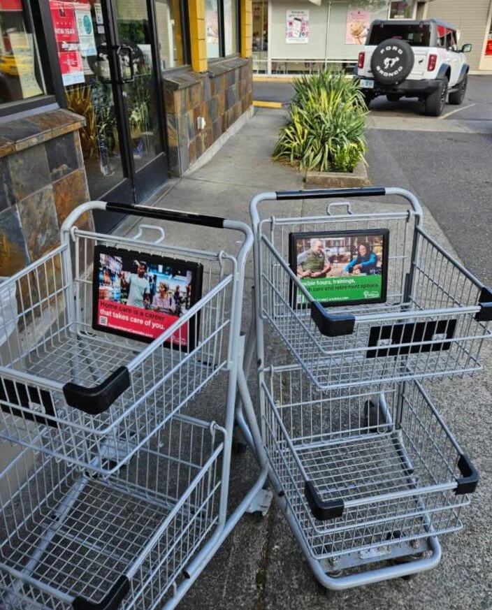 Shopping carts with ad panels outside a store