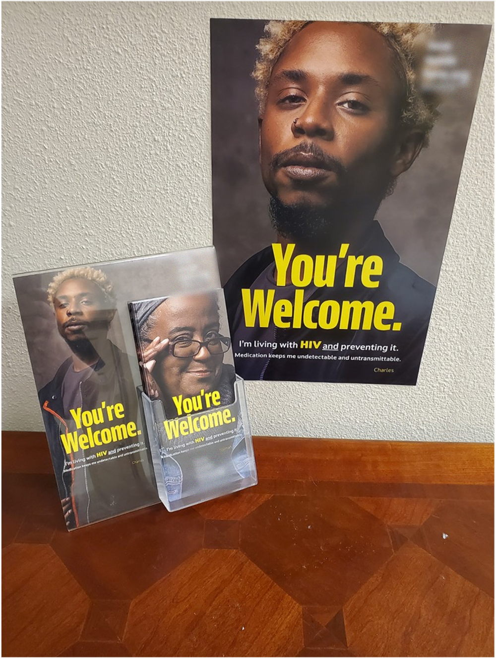 HIV prevention posters and take-one cards in a display stand