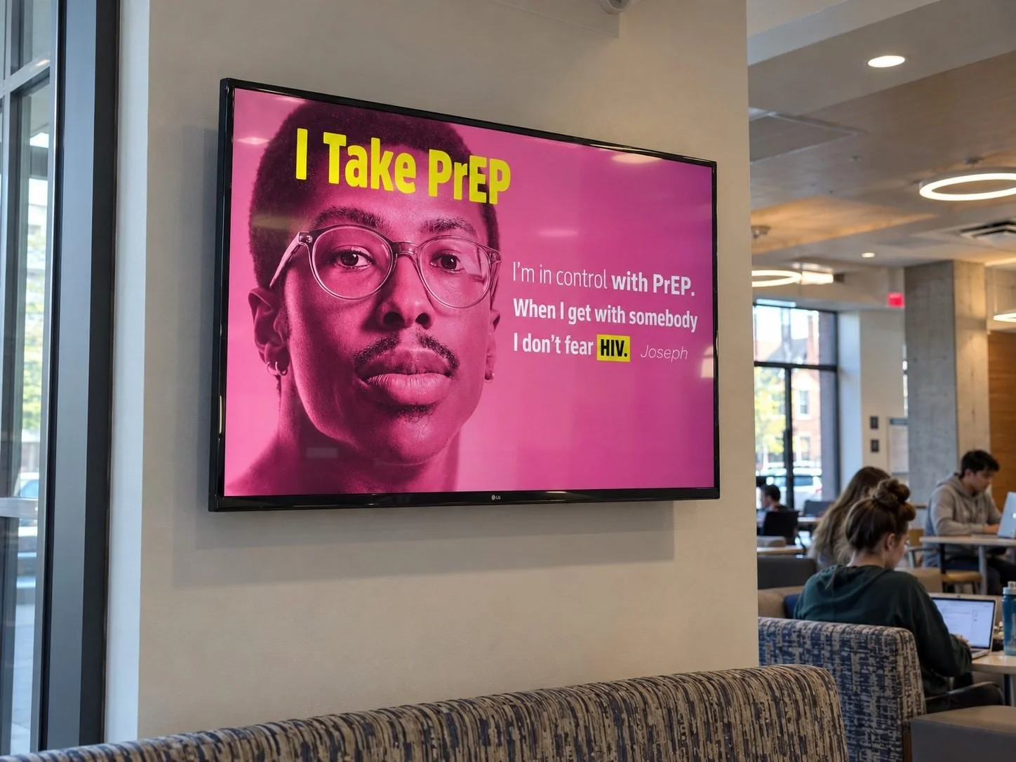 Digital screen ad in a college student lounge