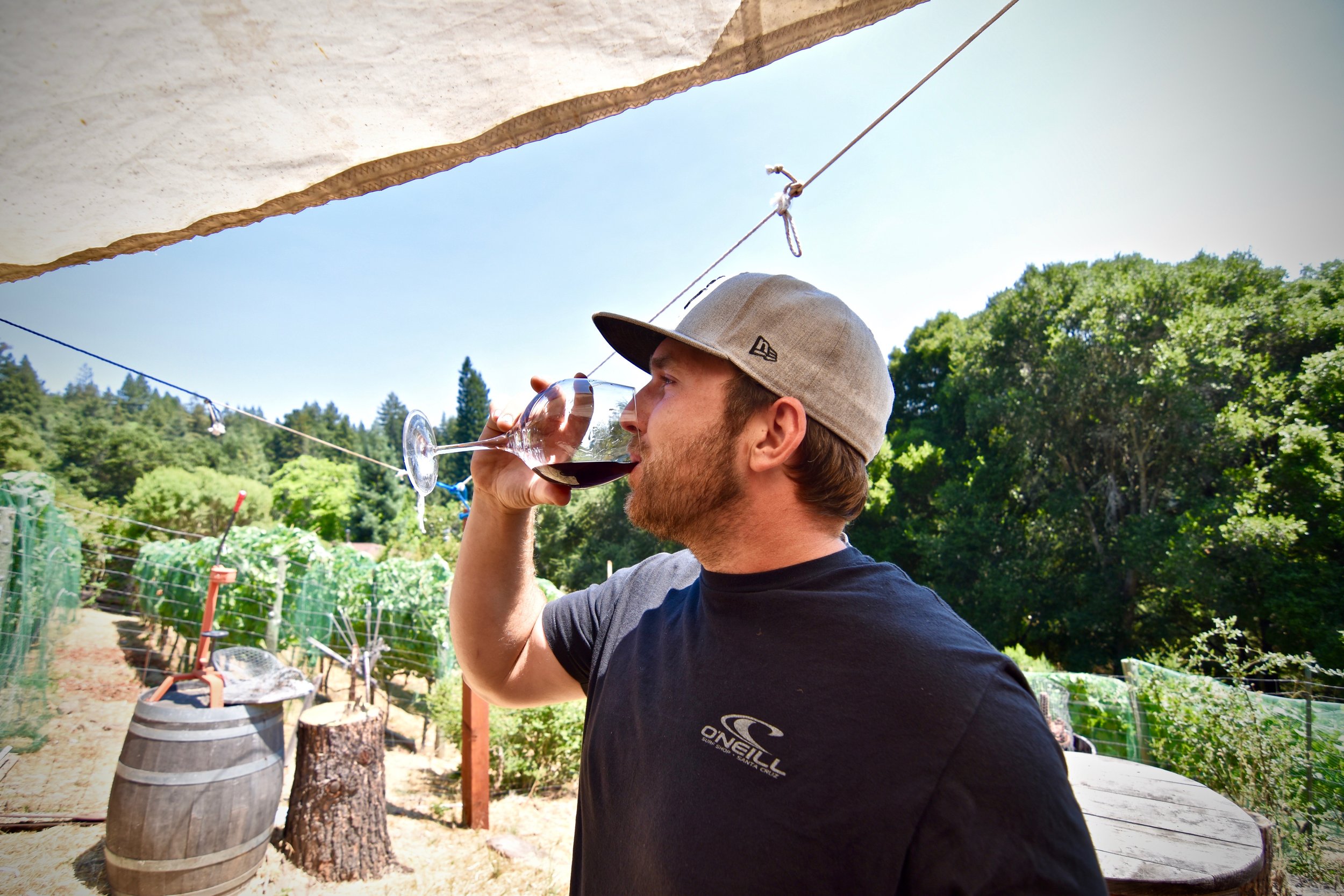 Man enjoying a glass of Roberts Ranch wine