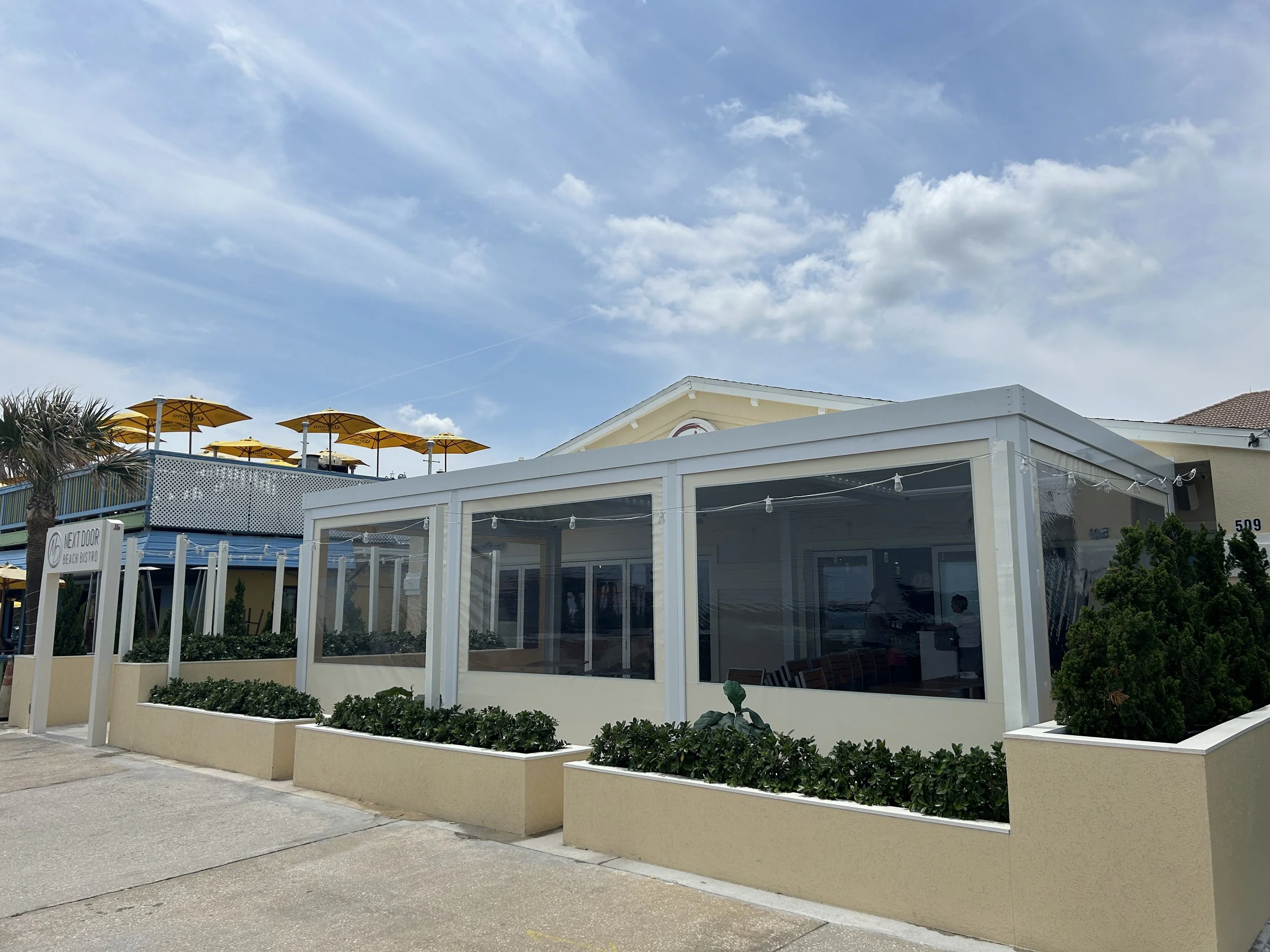 Fenetex Clear Com outside Next Door Flagler.JPG