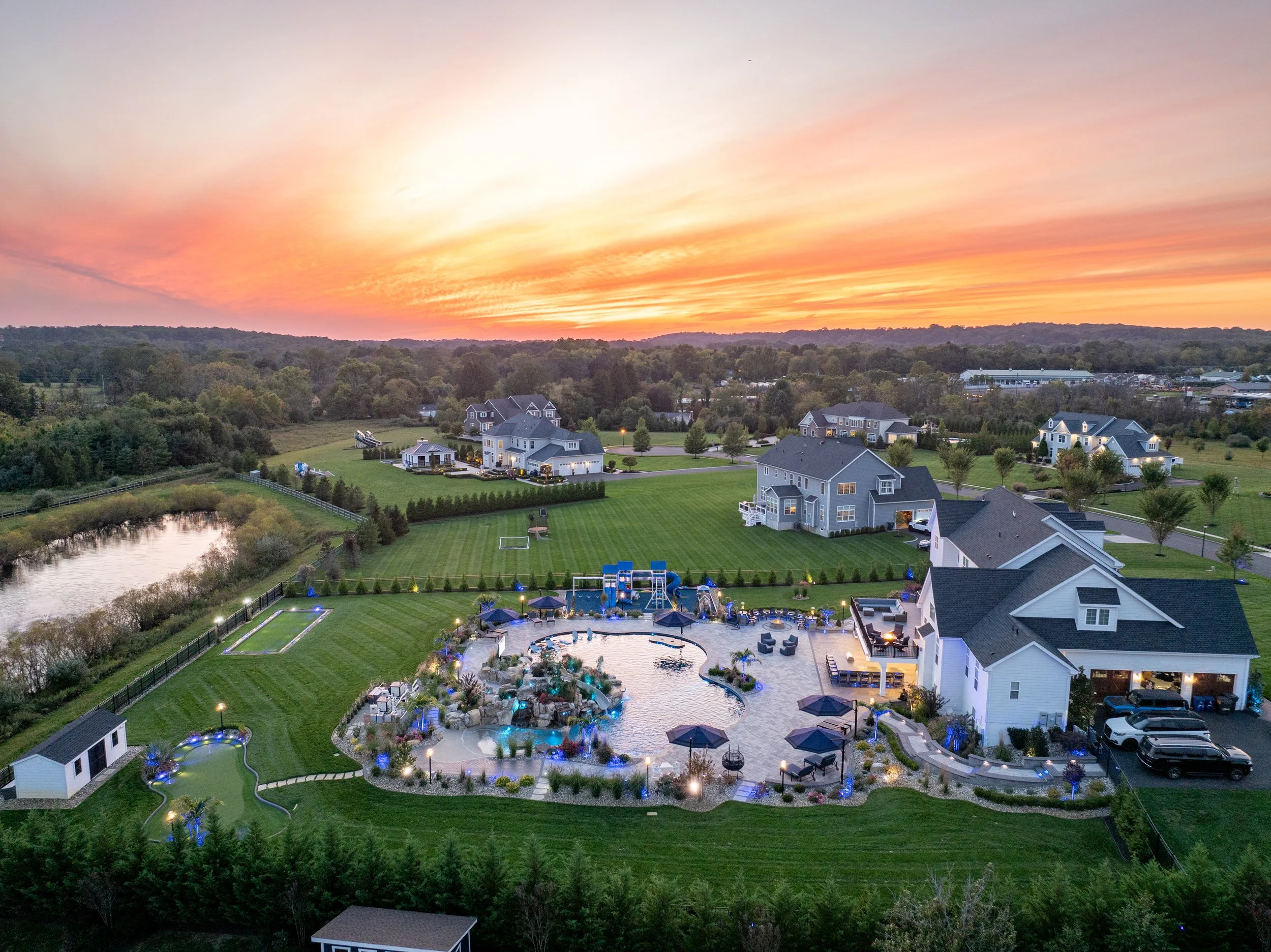 Holmdel, NJ: Inground Pool, Boulder Grotto, Paver Patio, Deck, Outdoor Kitchen, Putting Green