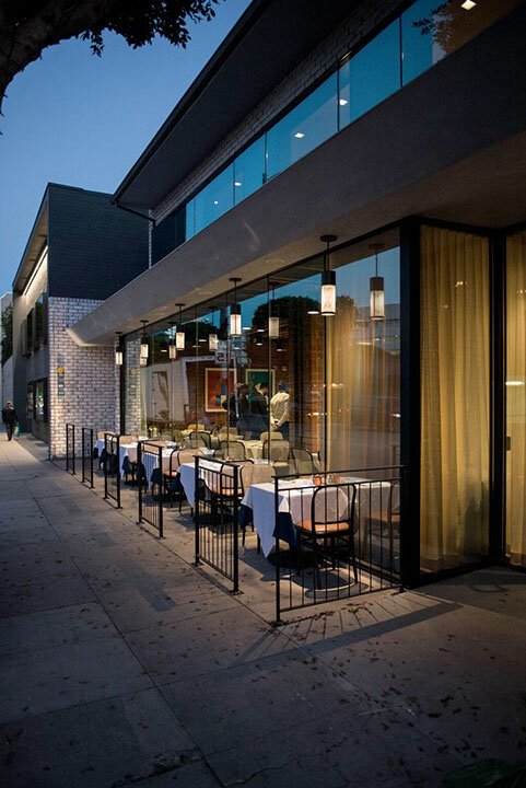  An evening view of the street-side dining tables outside of Nerano 