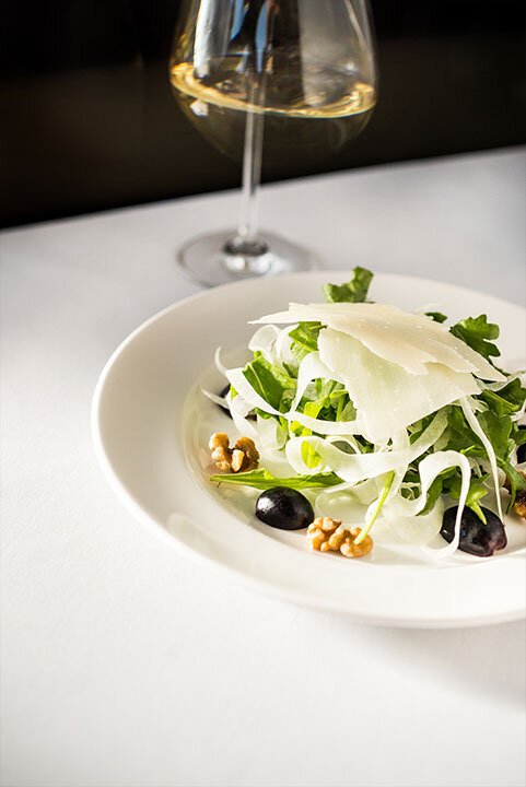  Salad with taggiasca olives, walnuts, parmesanm and a glass of white wine 