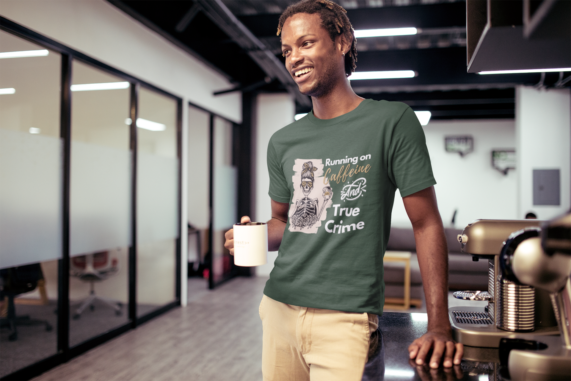 smiling-man-wearing-a-tshirt-mockup-having-a-coffee-at-the-office-a20524.png