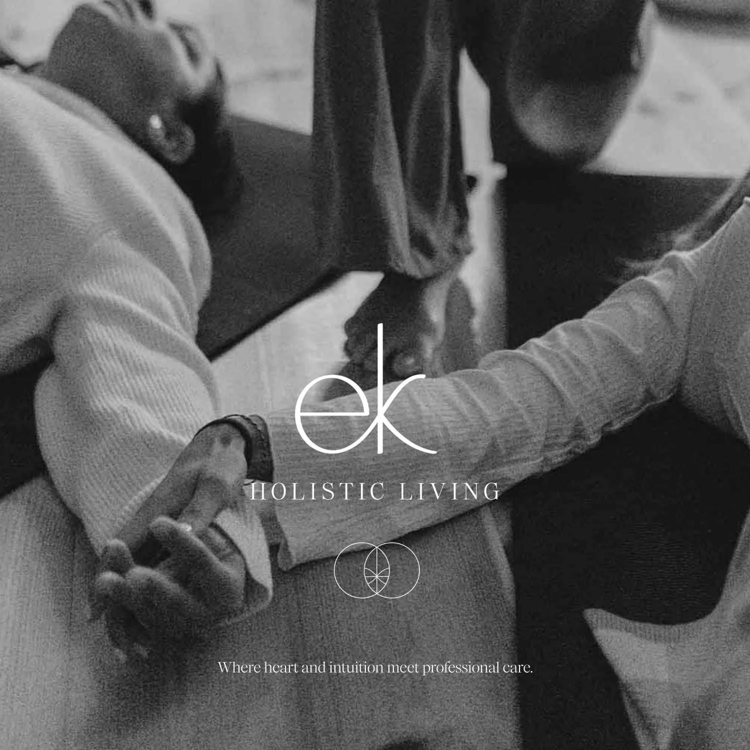 A mock-up of the brand identity and logo designed by Indeko Creative, for EK Holistic Living, over a photo of two people holding hands during a holistic therapy session.