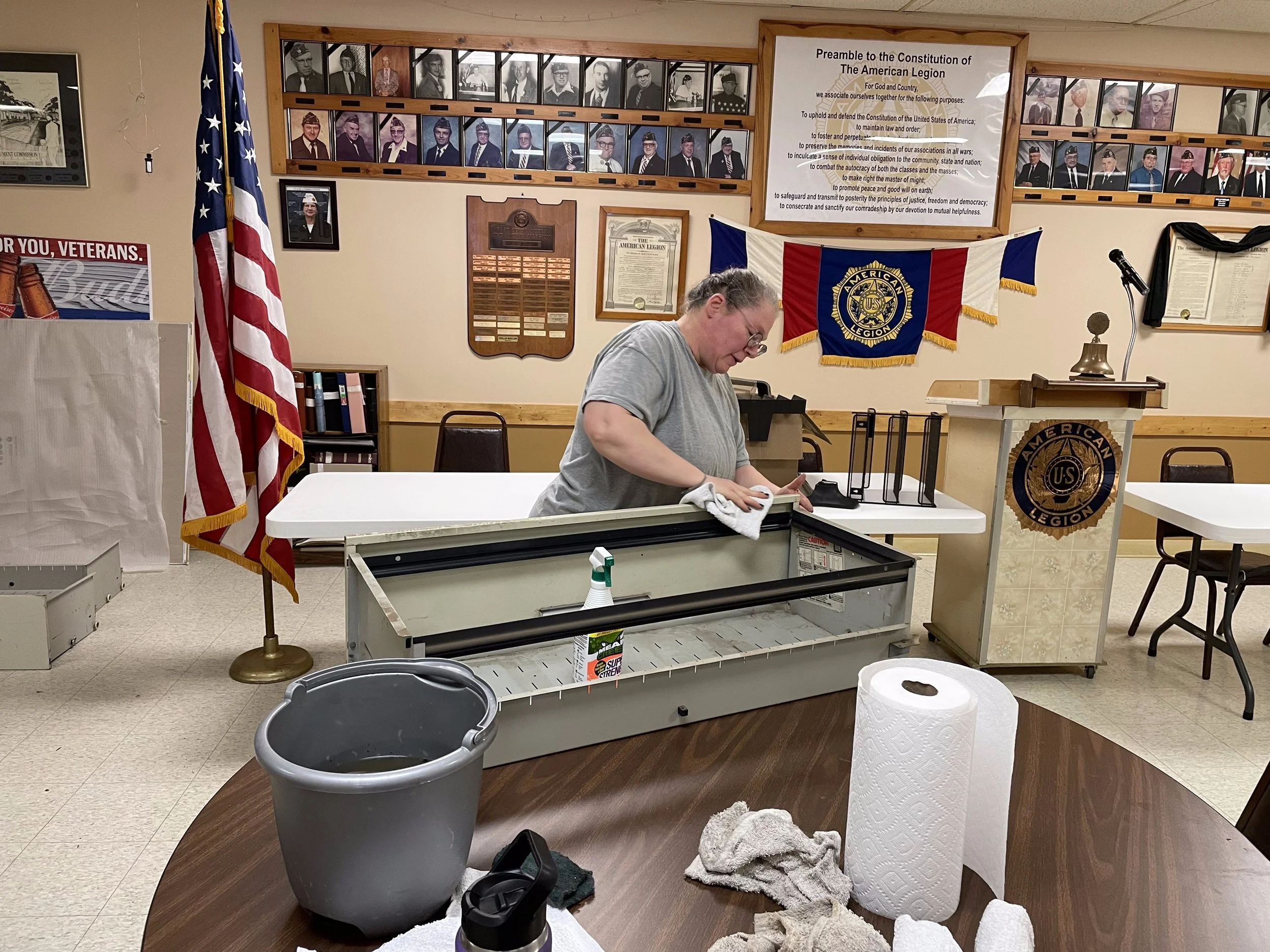 mary cleaning file cabinet.jpeg