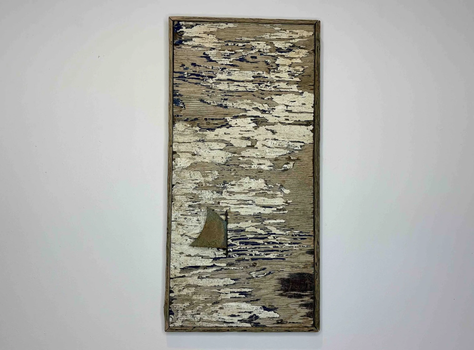 LUNAR ECLIPSE  •  20.5 x 10.5  hand-cut copper sail detail mounted in relief on found weathered plywood panel from Nauset Beach. Edged with reclaimed oak lobster pot staving backed with mahogany plywood.  •  $3800
