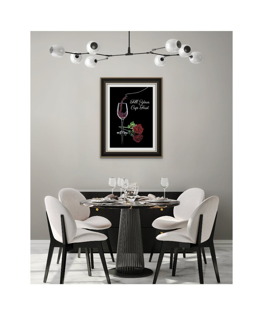 Matte Paper Print of Red Wine Pouring into Wine Glass with a Single Red Rose Lying Beside Glass, Black Background with White Text, "FILL YOUR CUP FIRST" Framed and Hanging on a Wall.