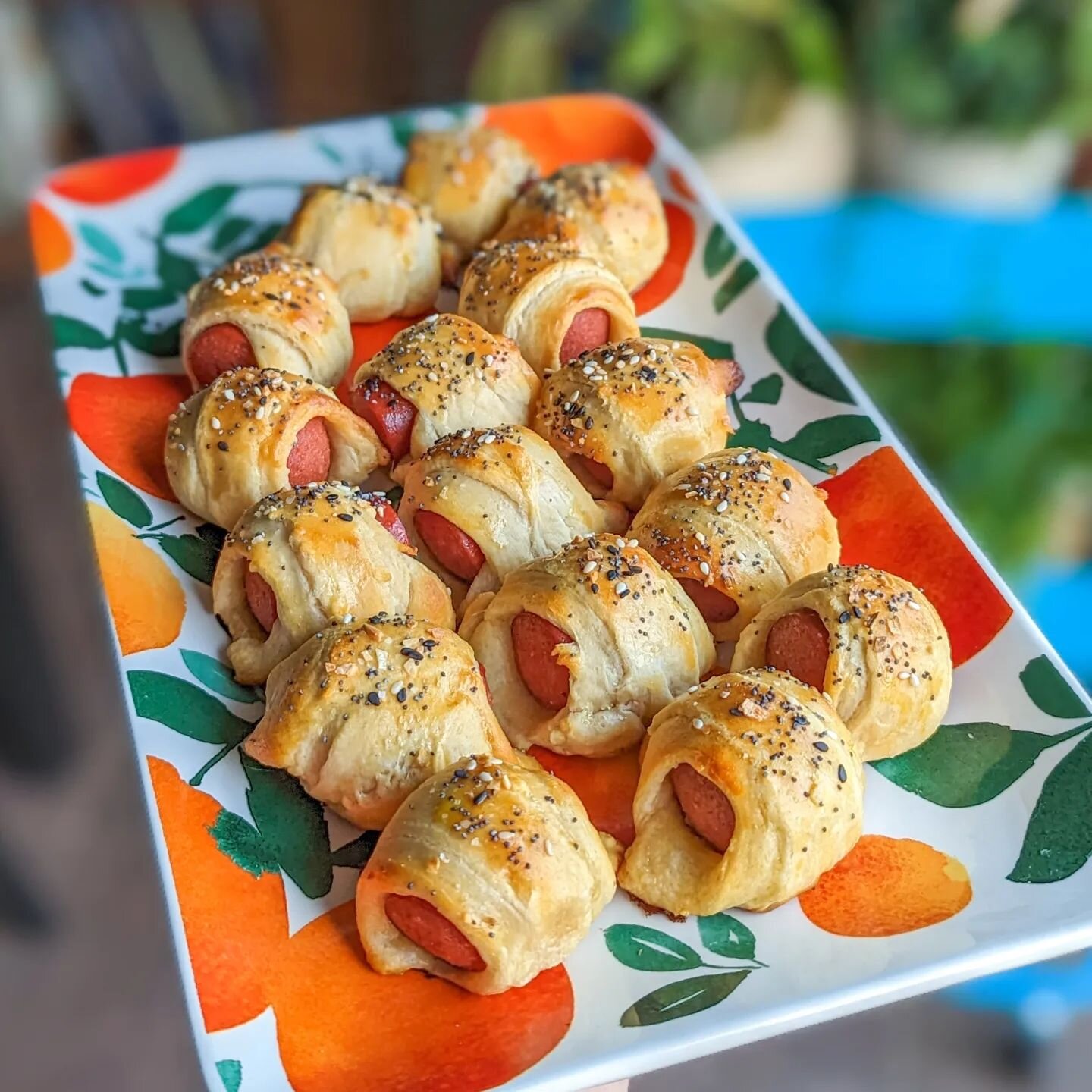 Mini pigs in a blanket and sausage dip
